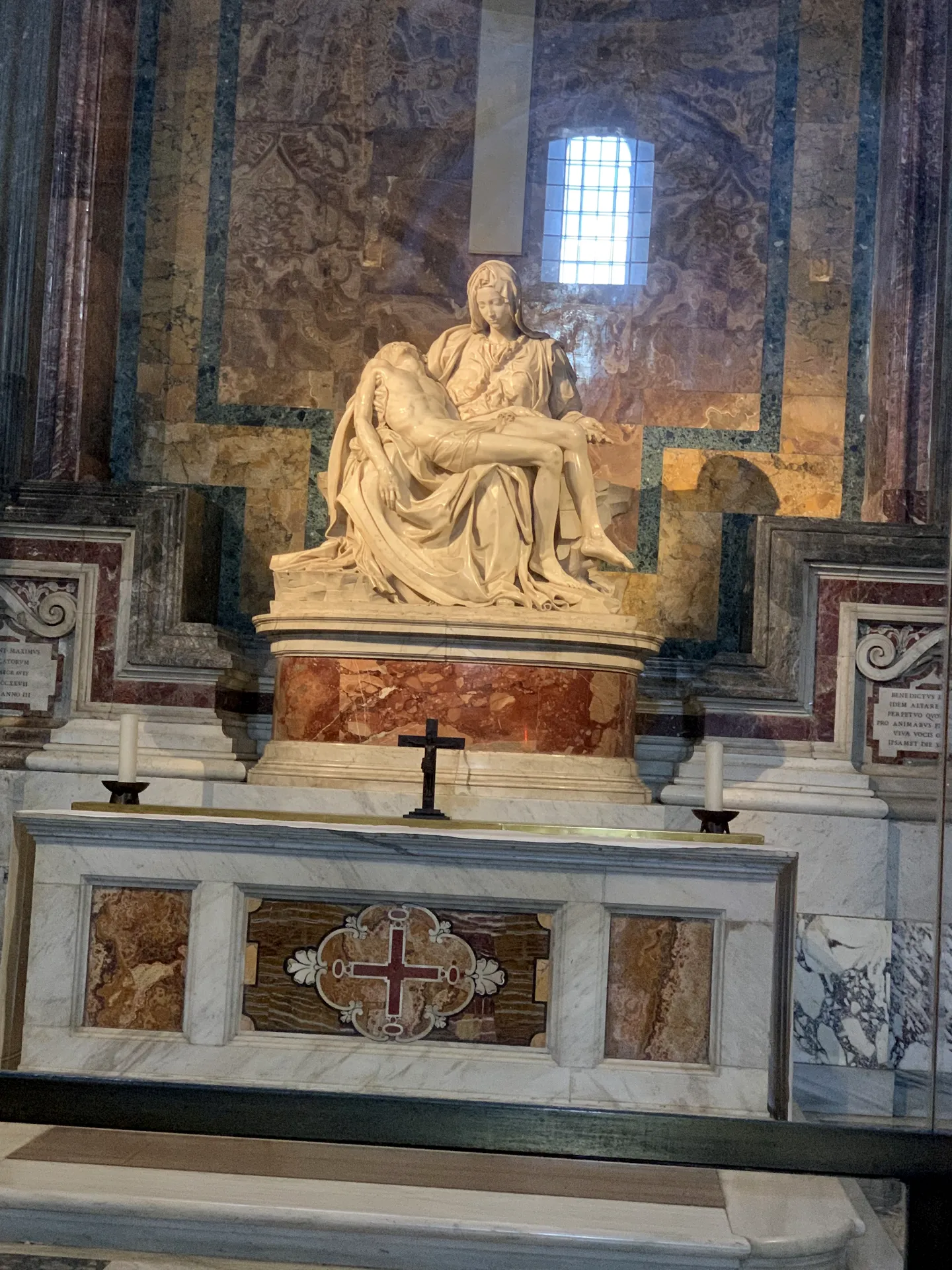 Michelangelo's Pieta lit by a shaft of window light, St. Peter's Basilica