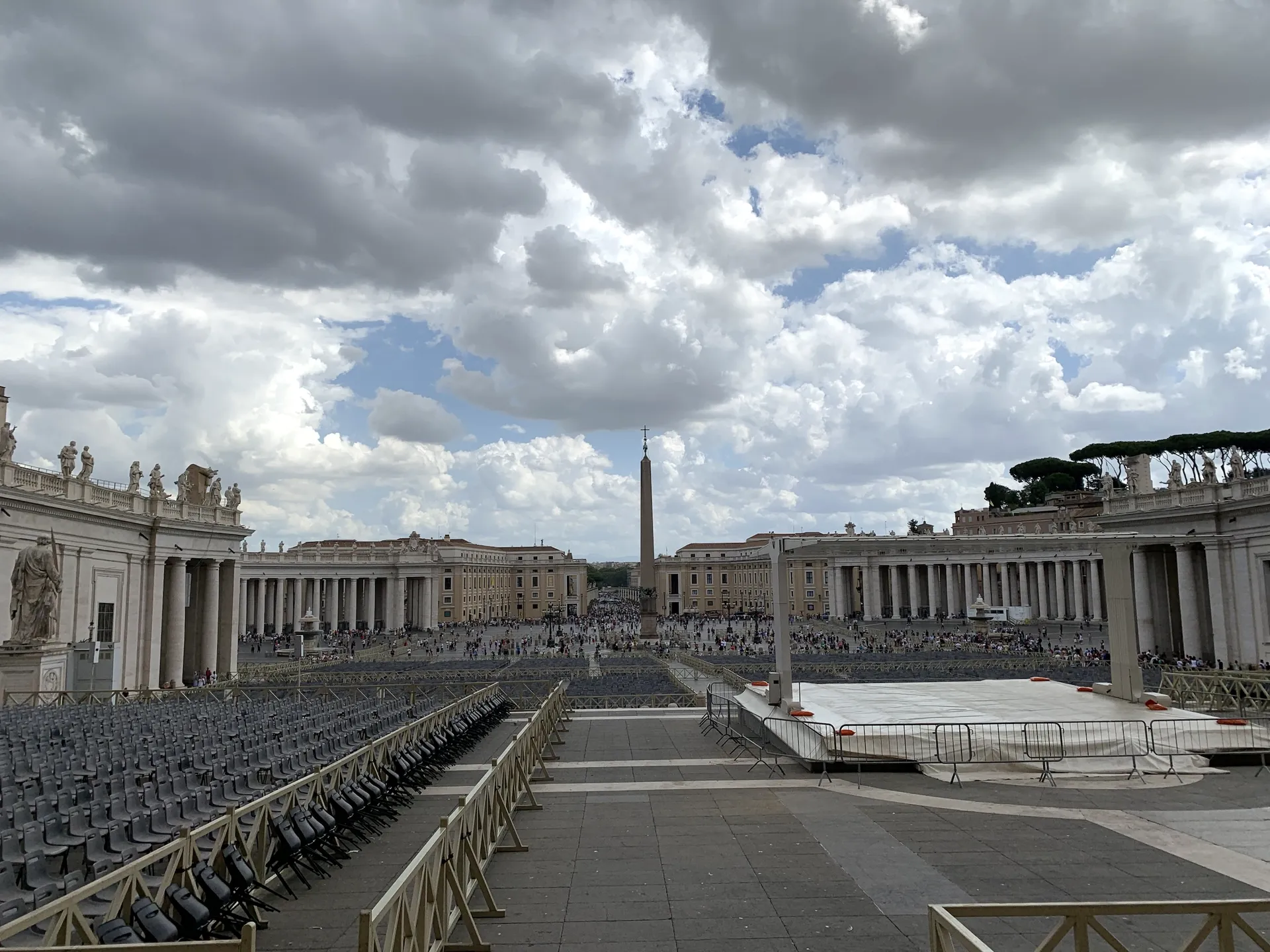 St. Peter's Square and Bernini's colonnade under a dramatic cloudy sky