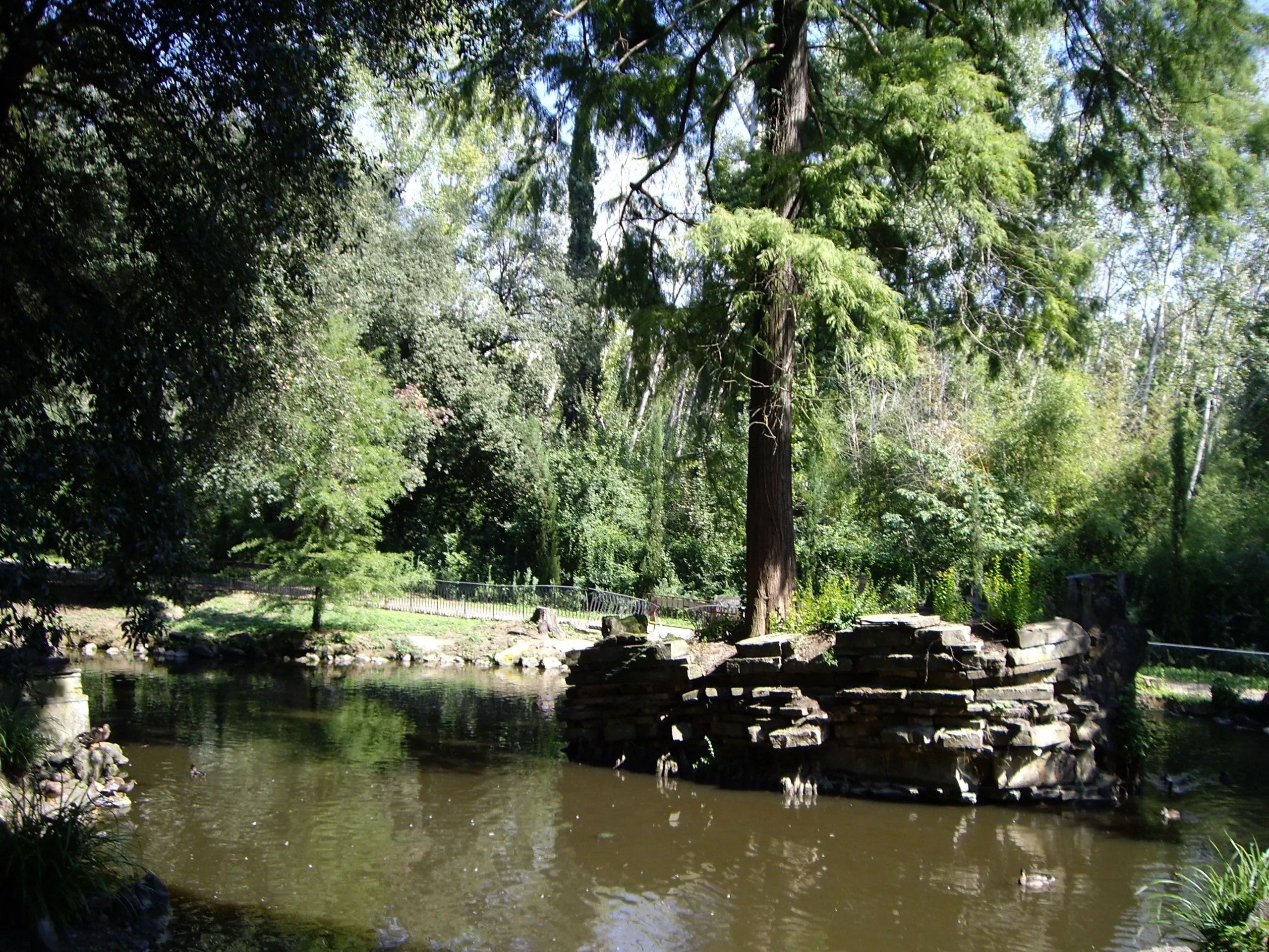 The lake at the centre of the Stibbert park, with its artificial rock outcrop