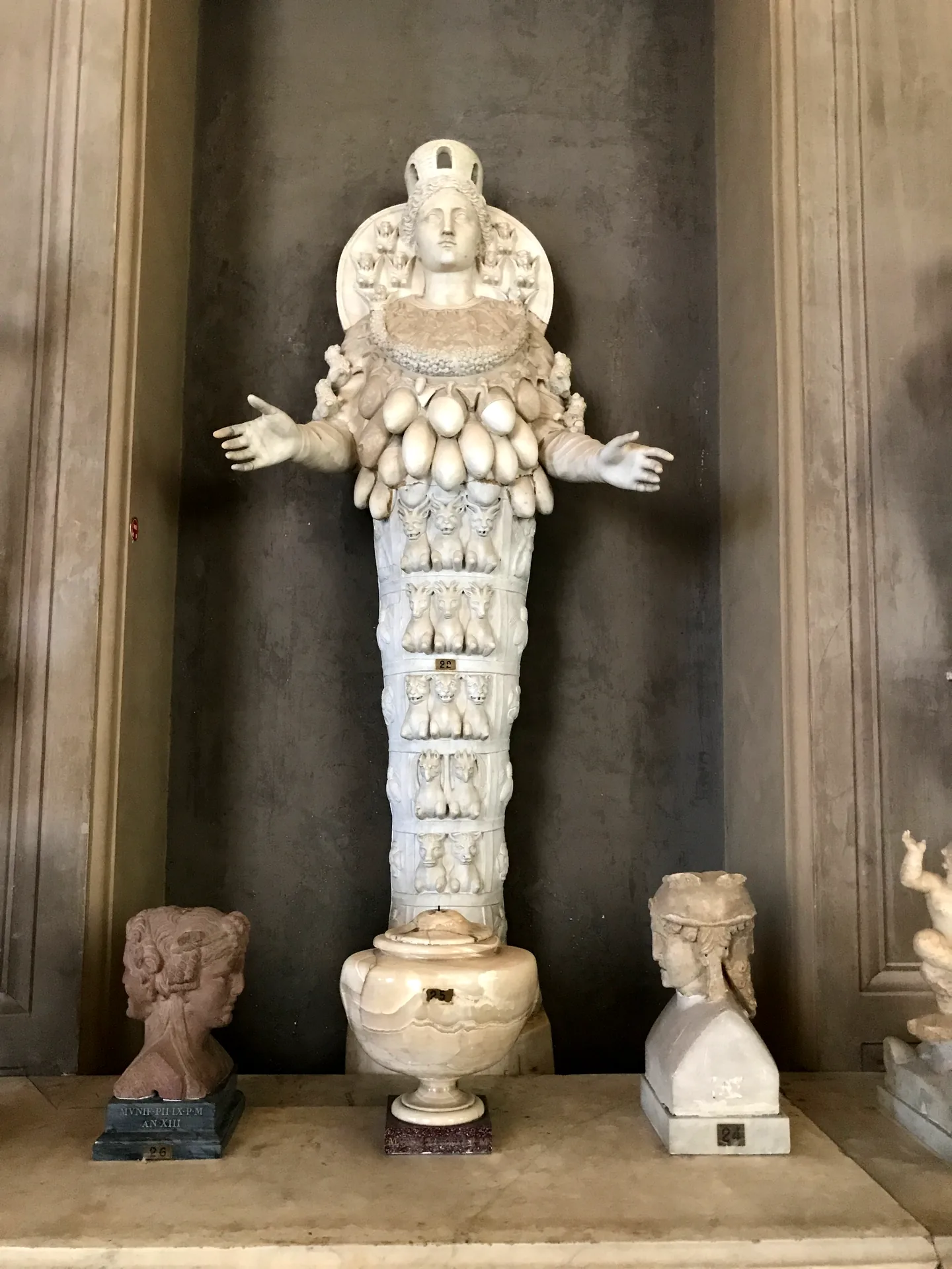 Roman statue of the many-emblemed Artemis of Ephesus in alabaster and bronze.