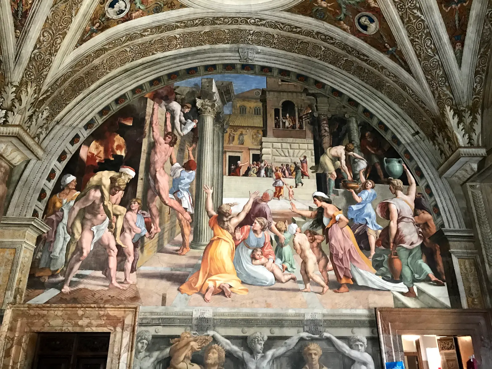 Raphael's fresco the Fire in the Borgo with figures fleeing a blaze.