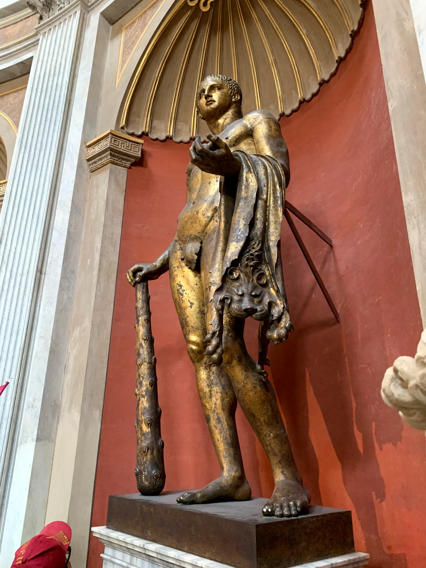 The gilded bronze statue of Hercules in the Sala Rotonda of the Vatican Museums.
