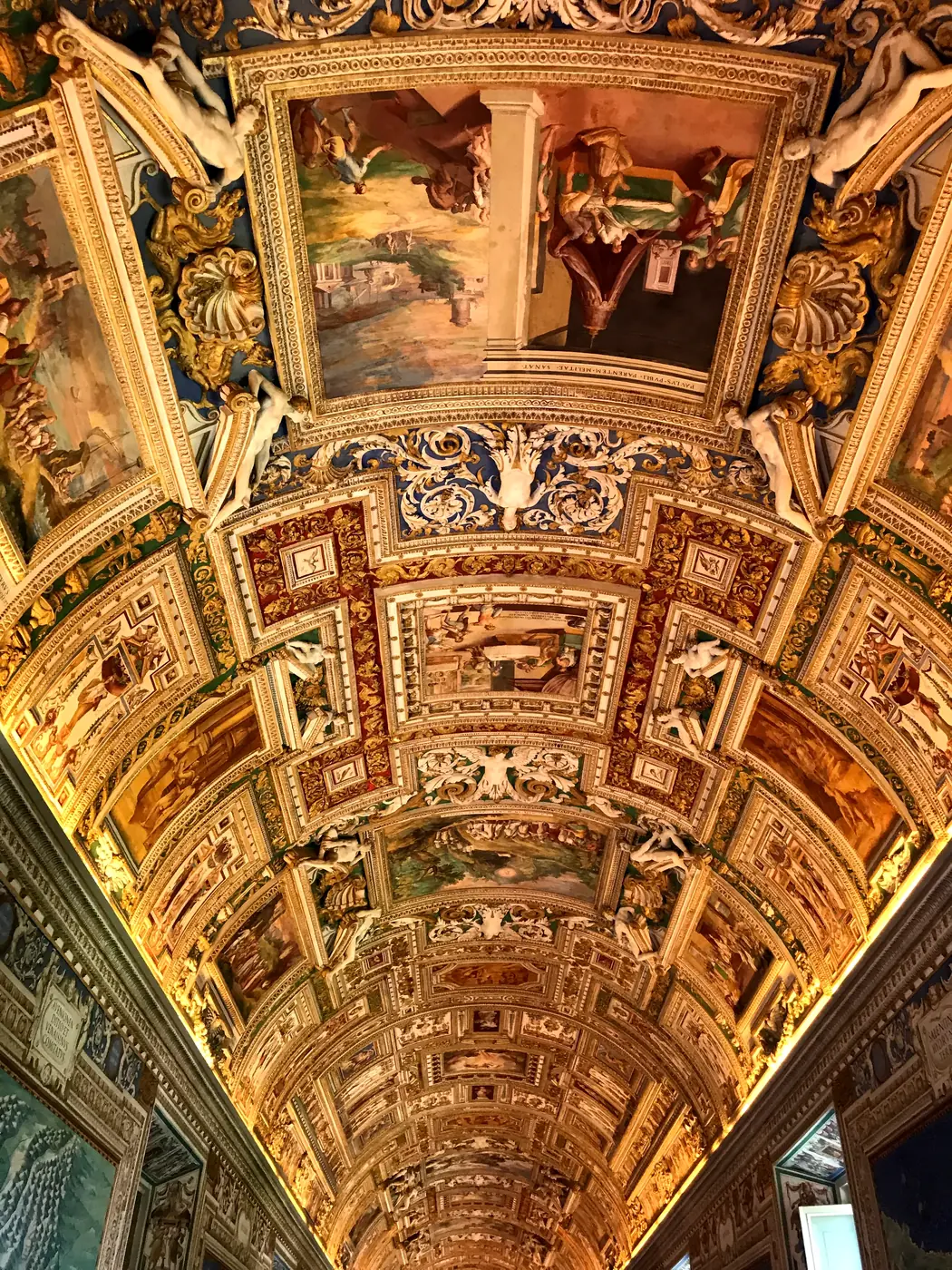 Gilded stucco and fresco detail of the vaulted ceiling in the Gallery of Maps.