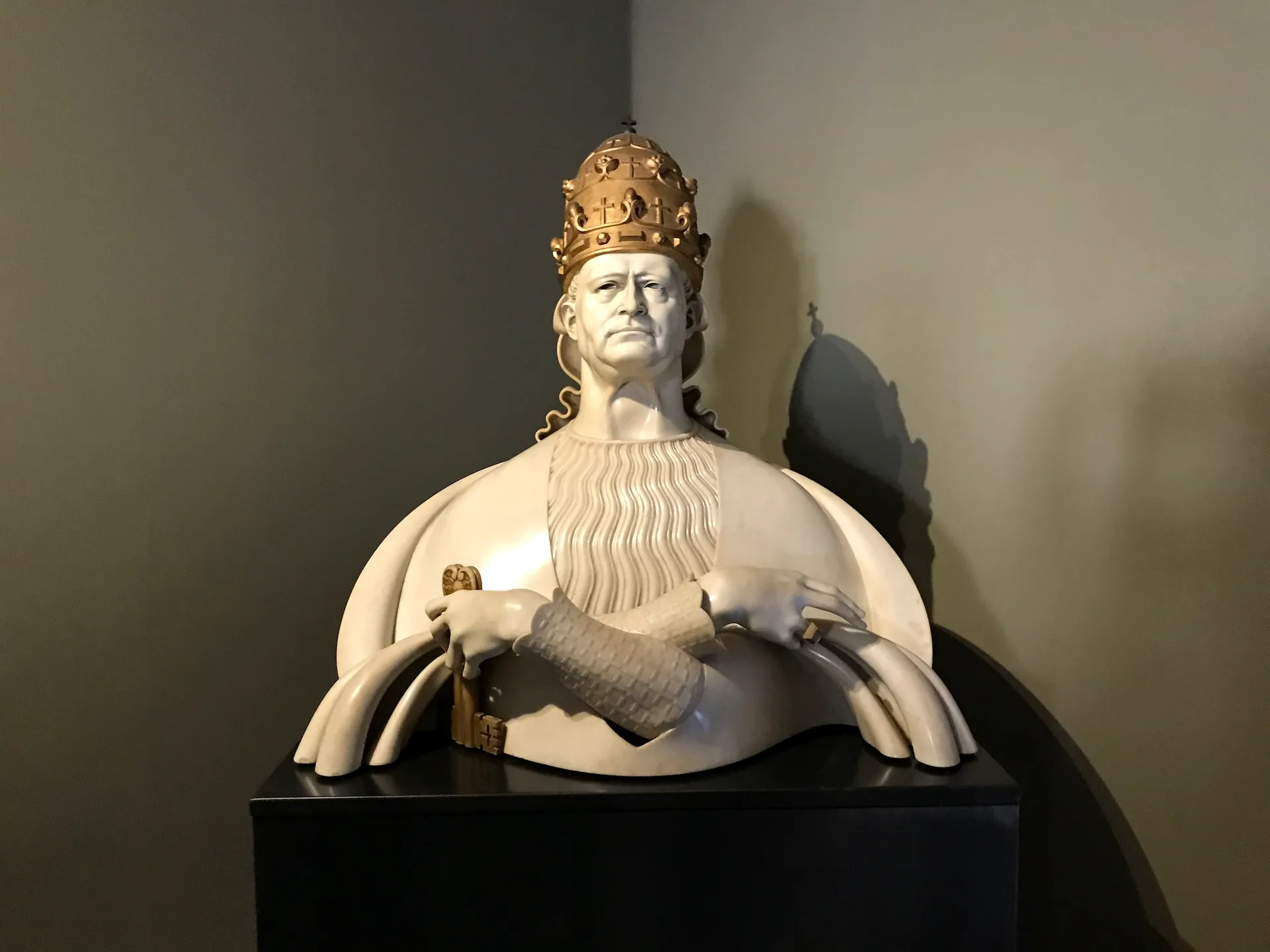 Modern sculpture of a pope in the papal tiara in the Vatican's contemporary collection.