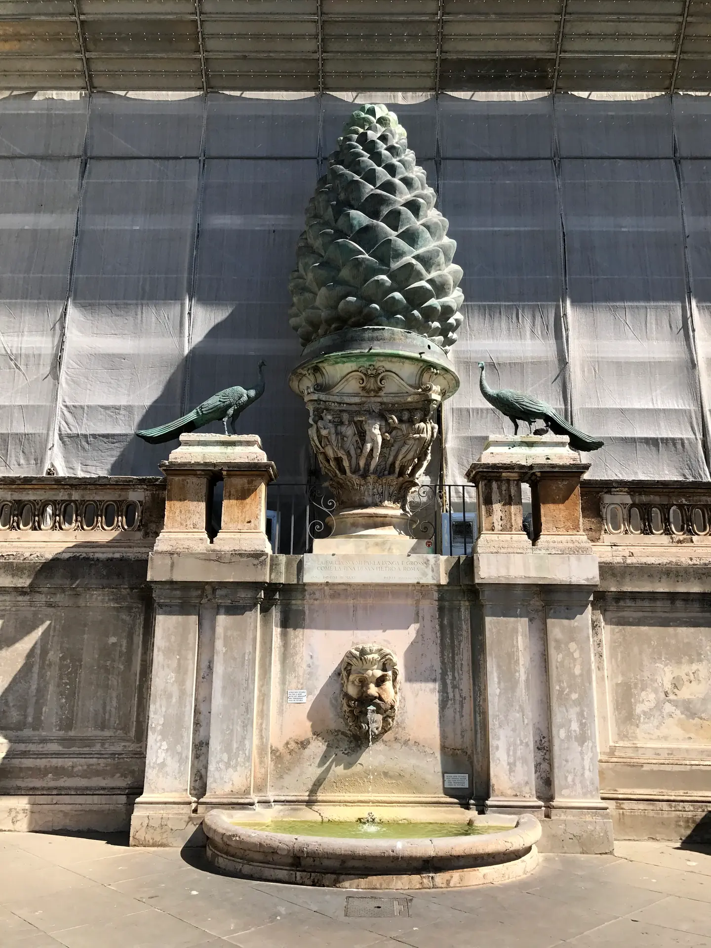 Ancient Roman bronze pinecone, the Fontana della Pigna, flanked by two bronze peacocks.