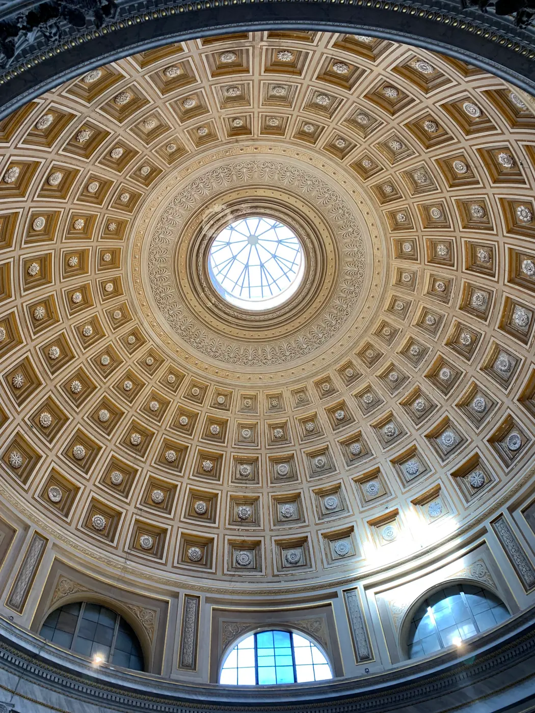 The coffered dome and oculus of the Sala Rotonda in the Vatican Museums.