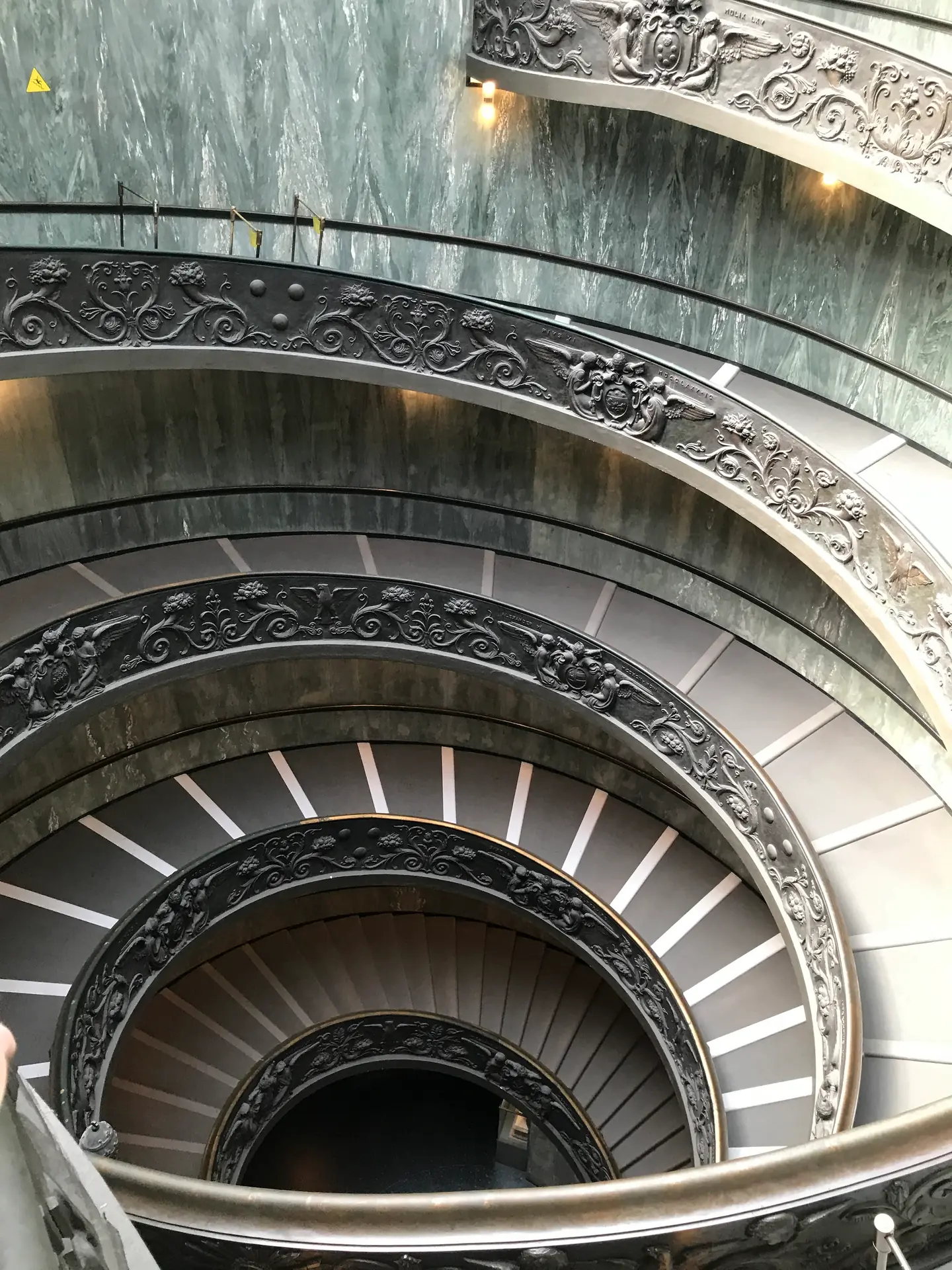 The double-helix spiral staircase in the Vatican Museums seen from above.