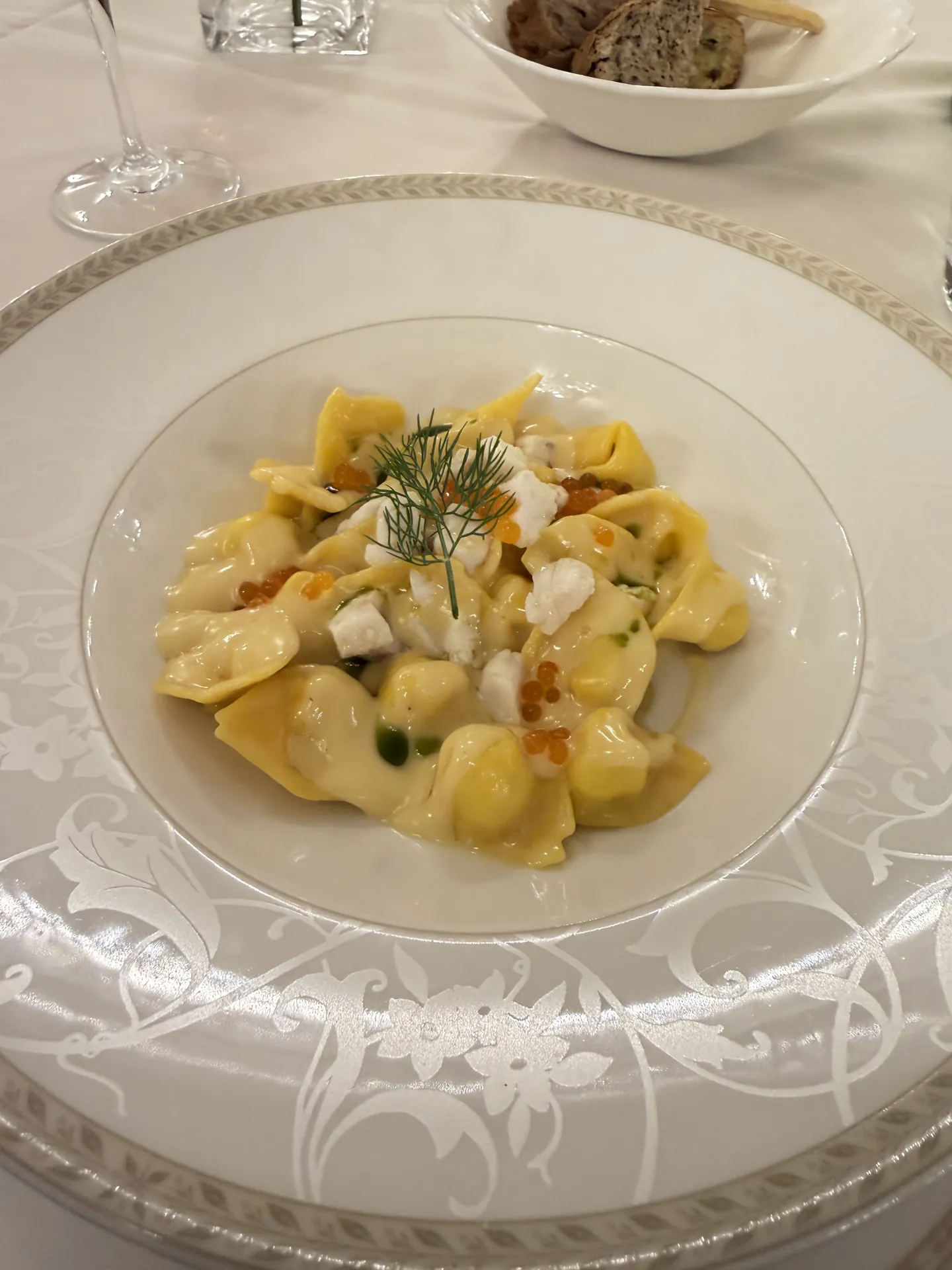 Sea bass raviolotti with citrus beurre blanc and fennel