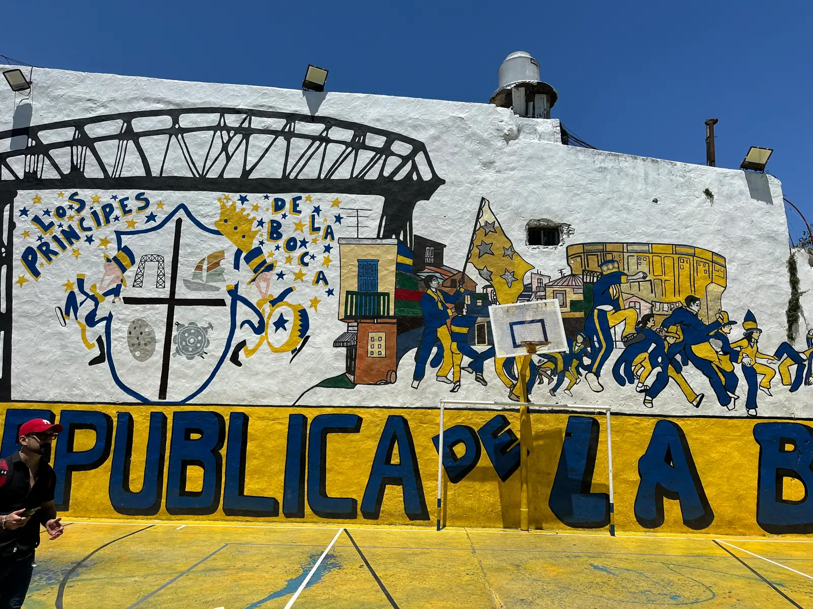 A mural reading Republica de La Boca with a crest on a wall in Buenos Aires.