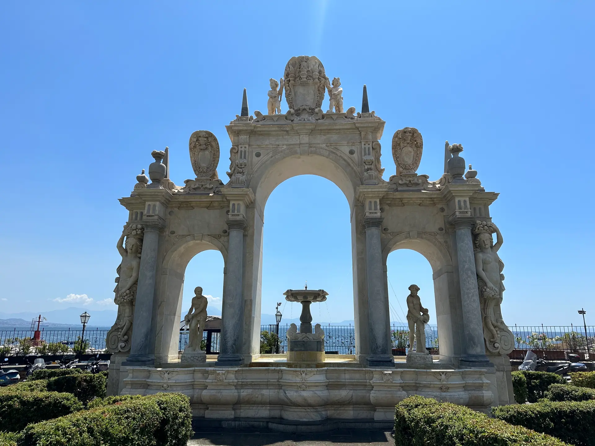 The Fontana dell'Immacolatella with its three marble arches on the Naples seafront.