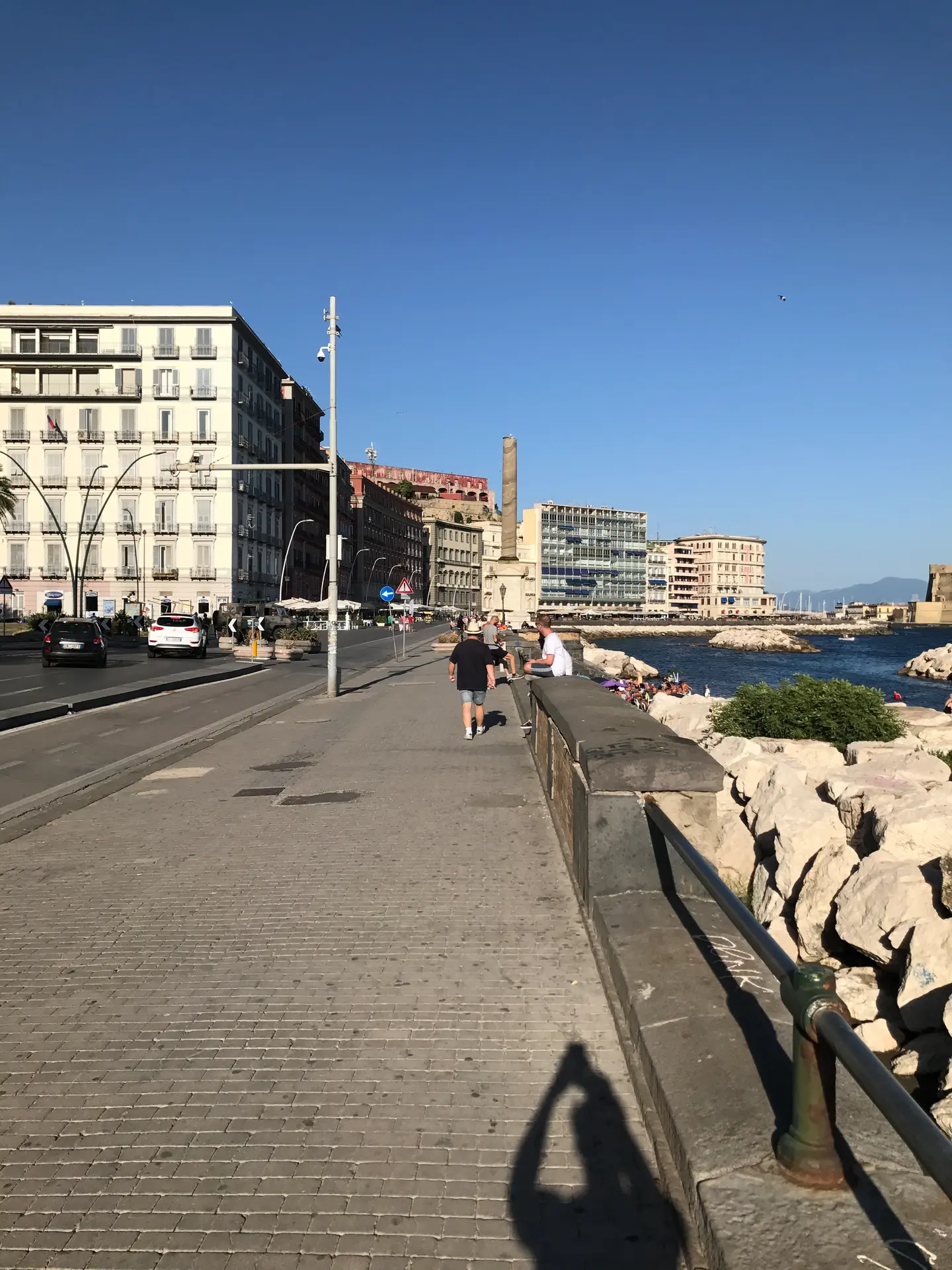 The paved seafront promenade in Naples running towards Castel dell'Ovo.
