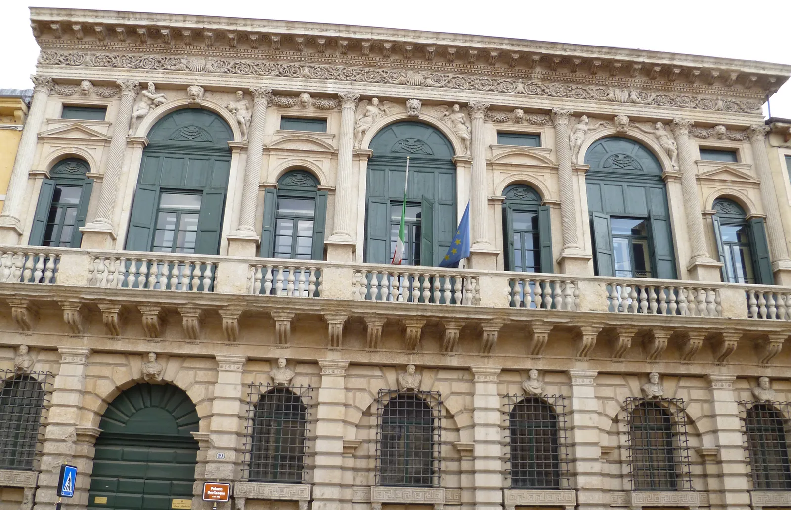 The facade of Palazzo Bevilacqua on Corso Cavour in Verona, alternating tall and short upper windows above a rusticated ground floor