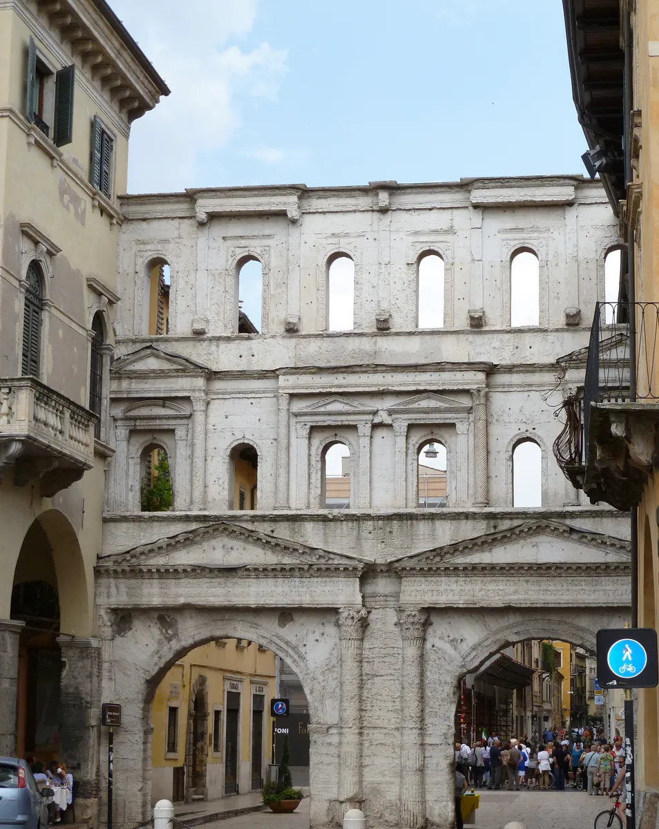 Porta Borsari, the Roman gate on the Corso in Verona, its white limestone front rising above the street