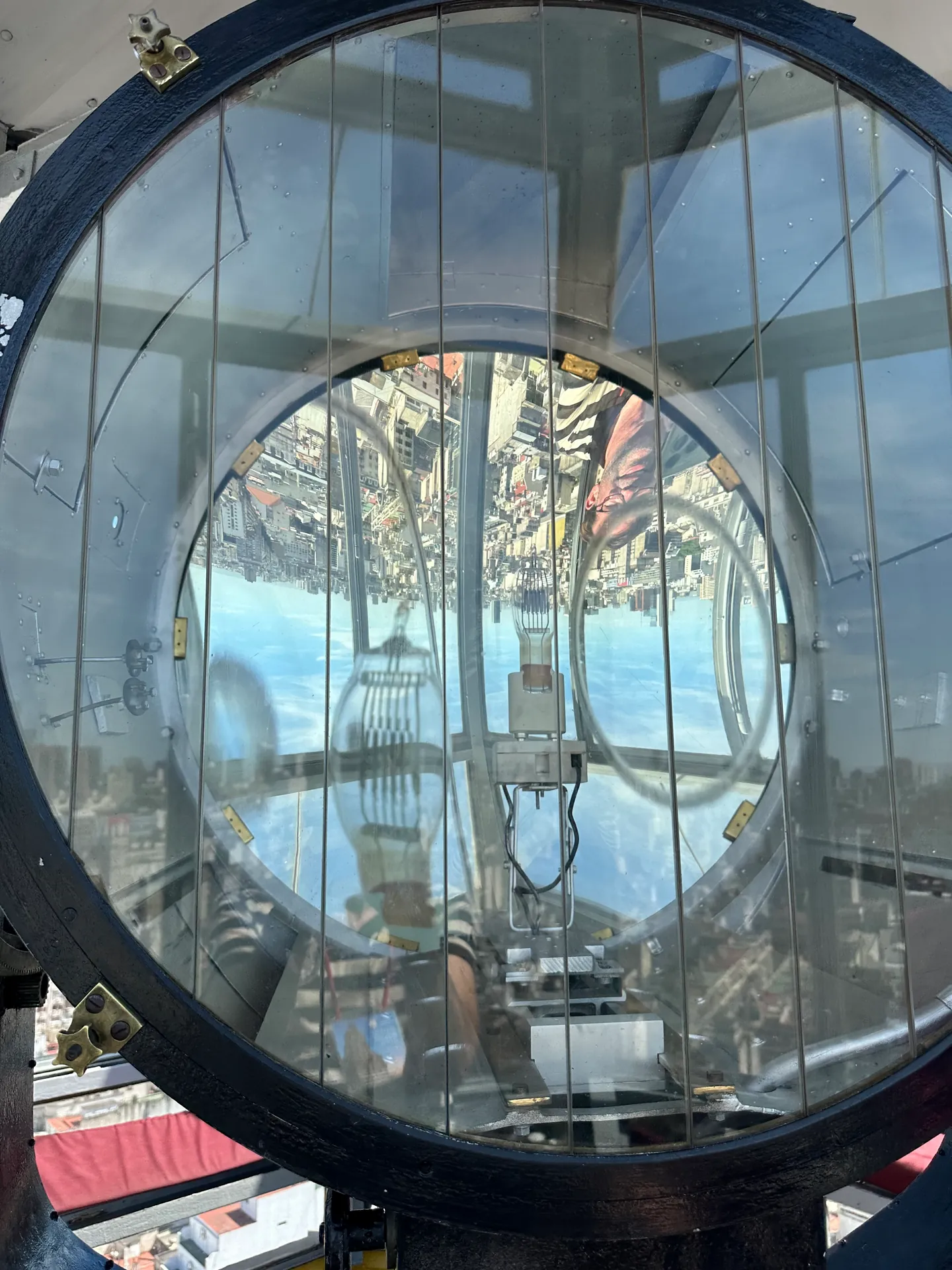 The great glass lens and mechanism of the lighthouse beacon at Palacio Barolo.