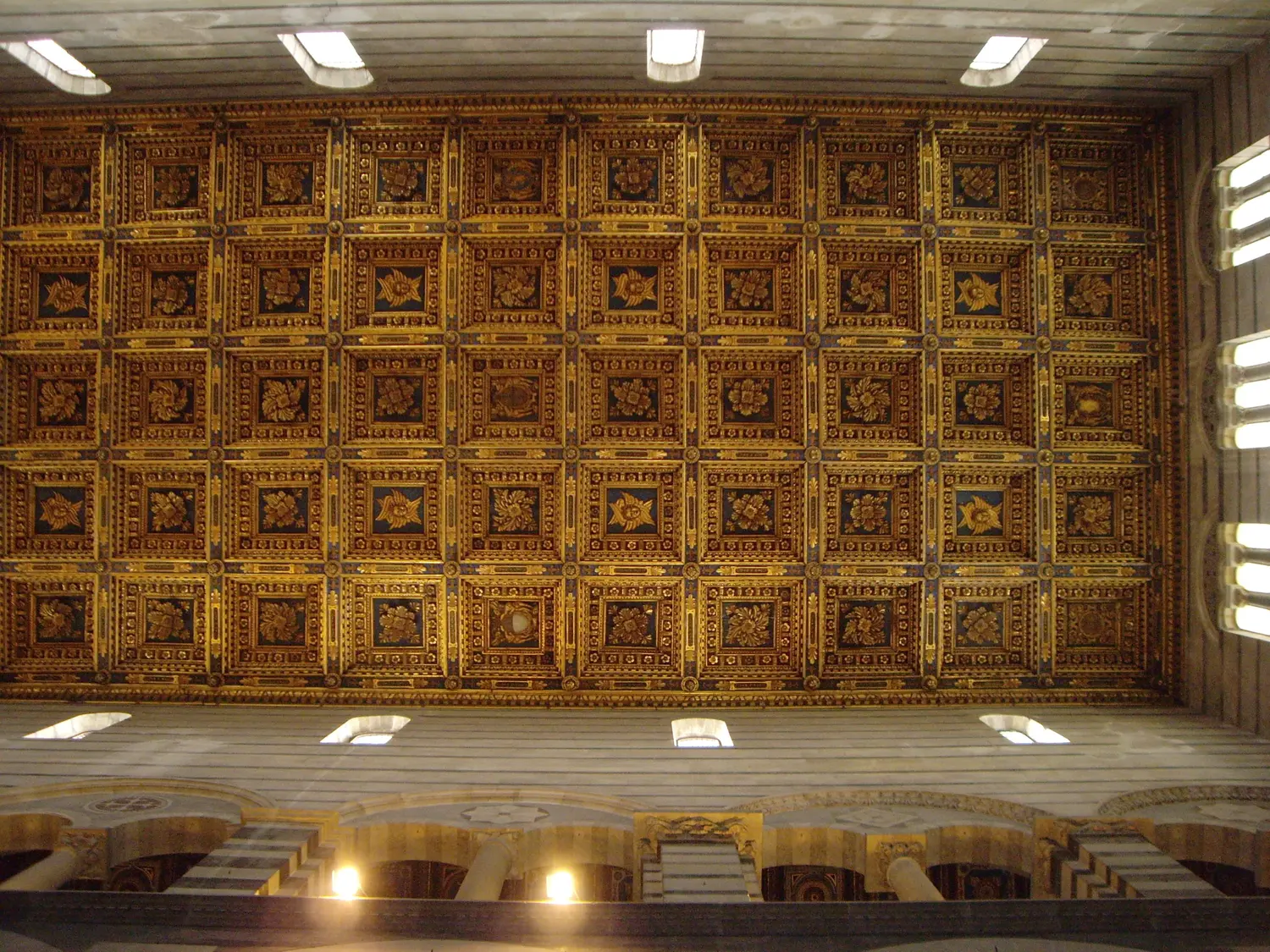 The gilded coffered ceiling of Pisa cathedral seen from directly below
