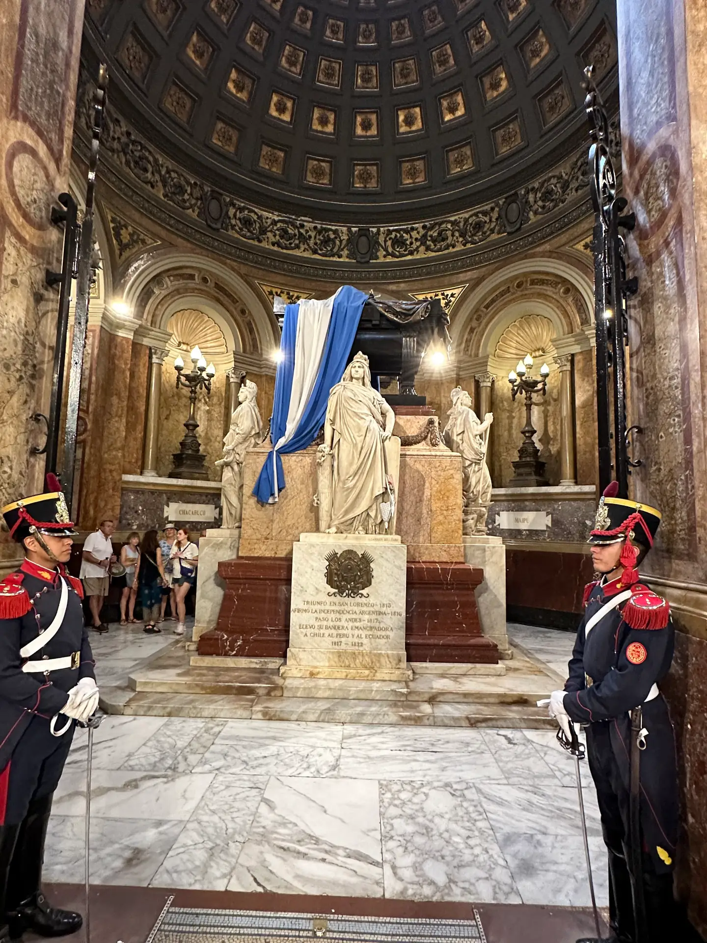 The marble mausoleum of General San Martin flanked by two uniformed grenadier guards.