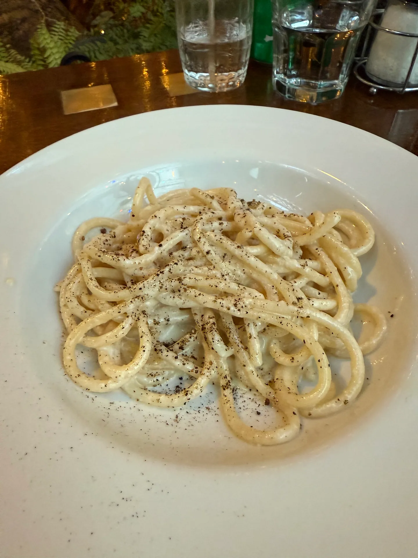 Thick pasta coated in a creamy pecorino sauce with cracked black pepper.