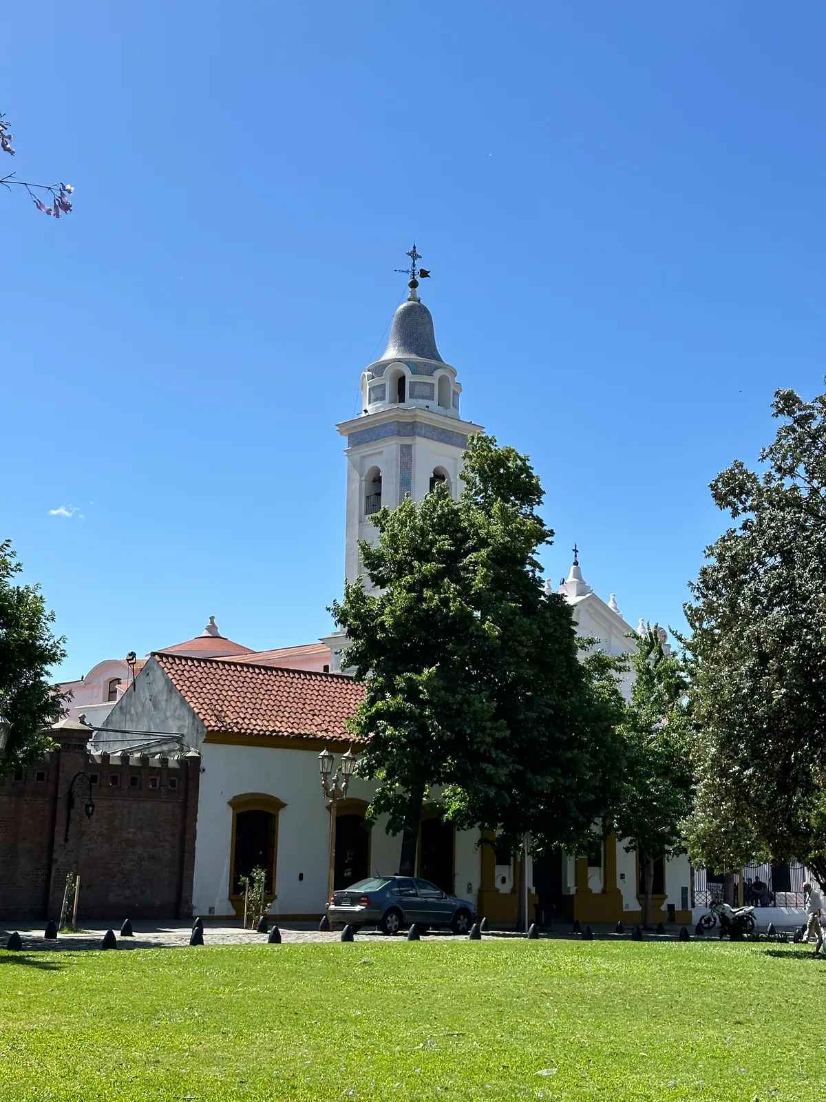 The white bell tower and facade of the Basilica del Pilar in Recoleta, Buenos Aires.