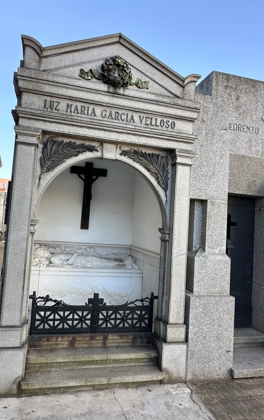 The tomb of Luz Maria Garcia Velloso, her name carved above a reclining marble effigy.