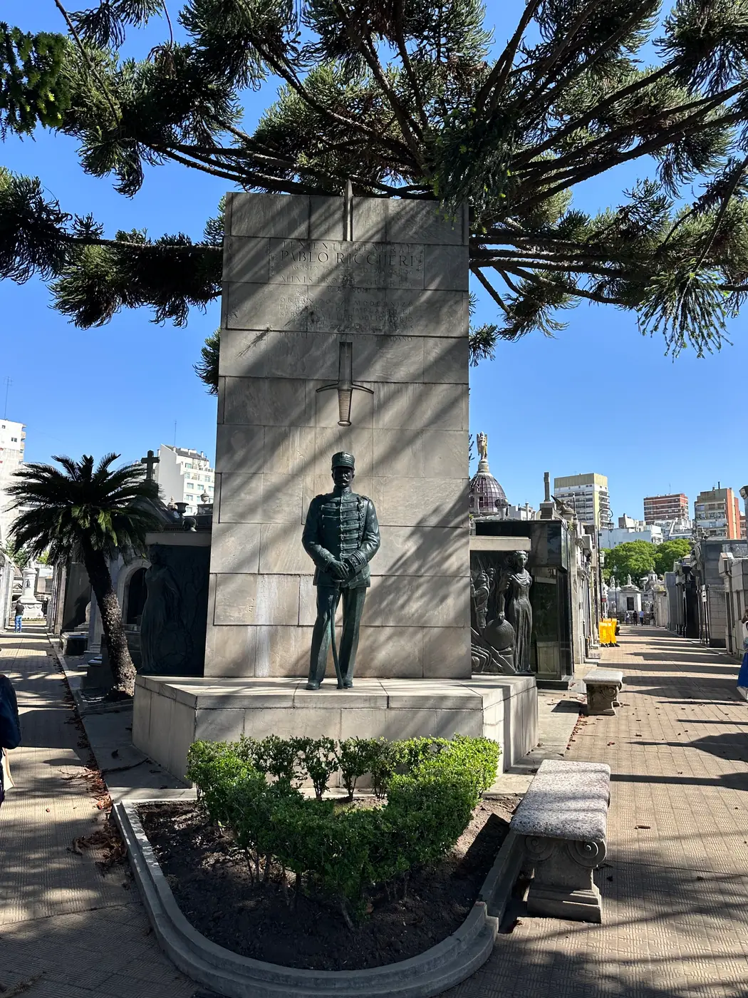 The bronze figure of General Pablo Riccheri before his stone monument in Recoleta Cemetery.