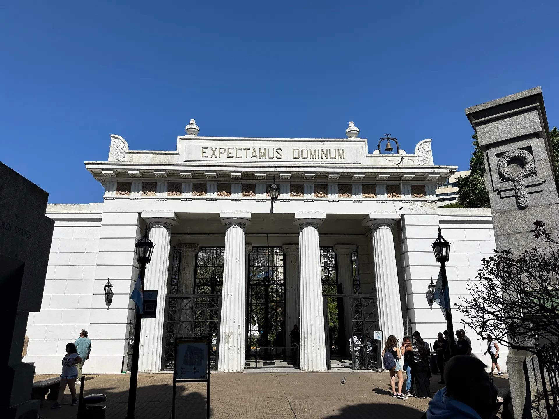 The neoclassical Doric entrance portico of Recoleta Cemetery with its Latin inscription.