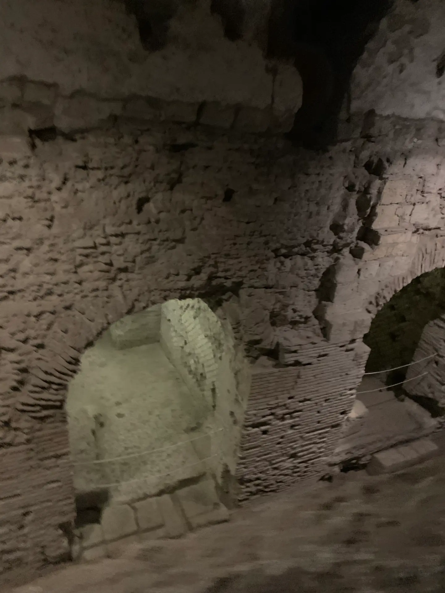 Quarried tuff and later stone masonry meeting in a wall below San Lorenzo Maggiore.