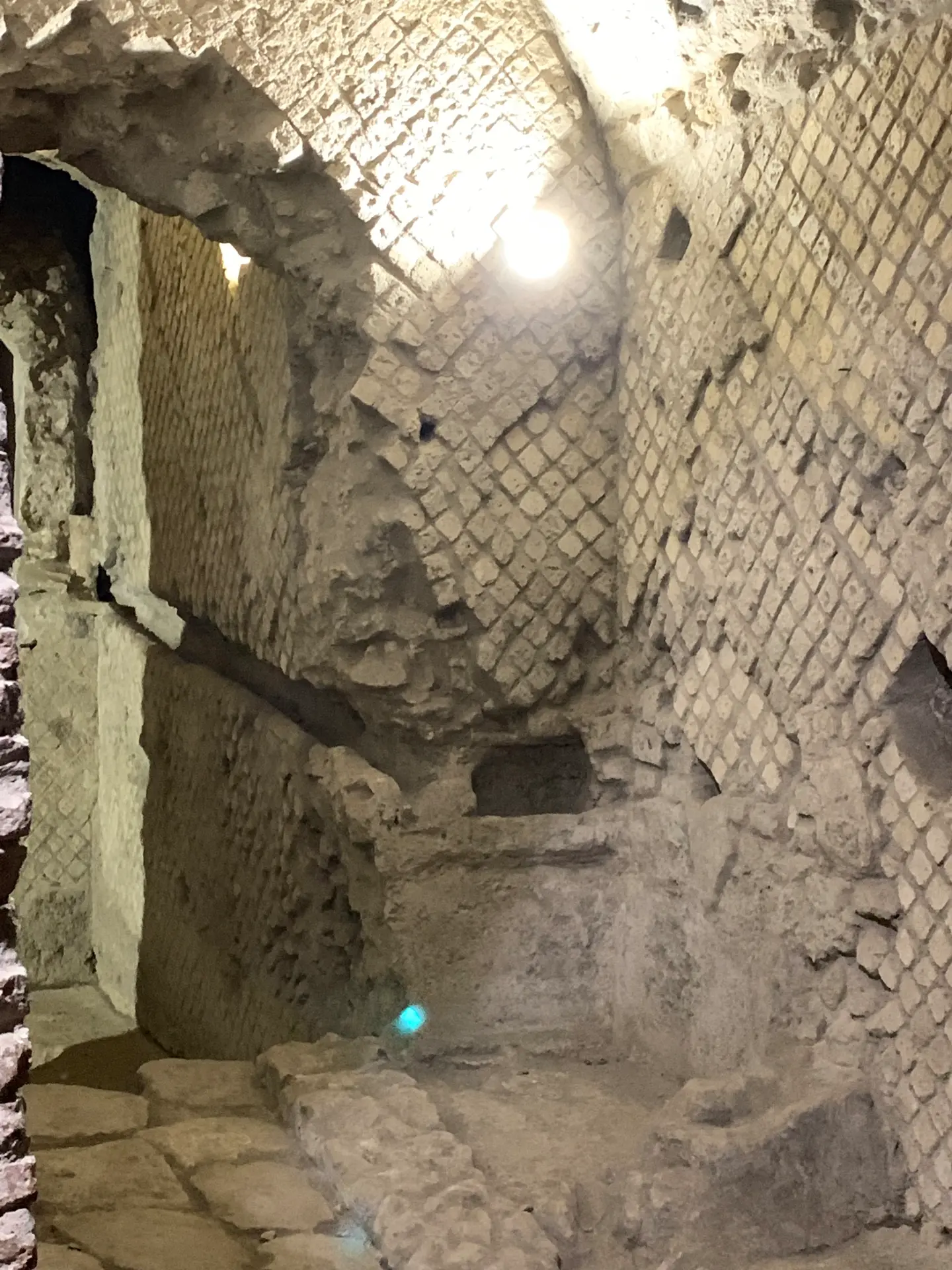 A wall of Roman opus reticulatum, small stones set diagonally in a net pattern.
