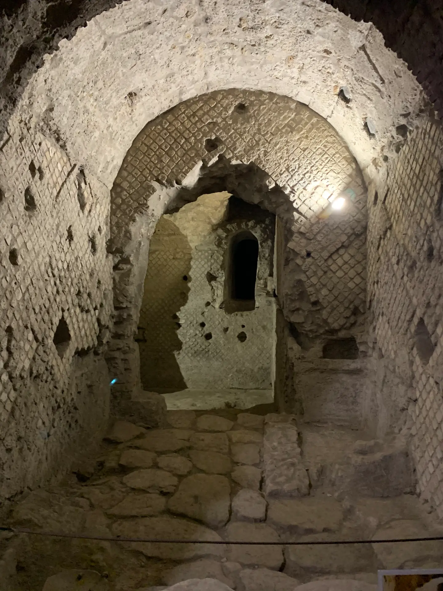 A niche high in the back wall of a Roman shop below San Lorenzo Maggiore.