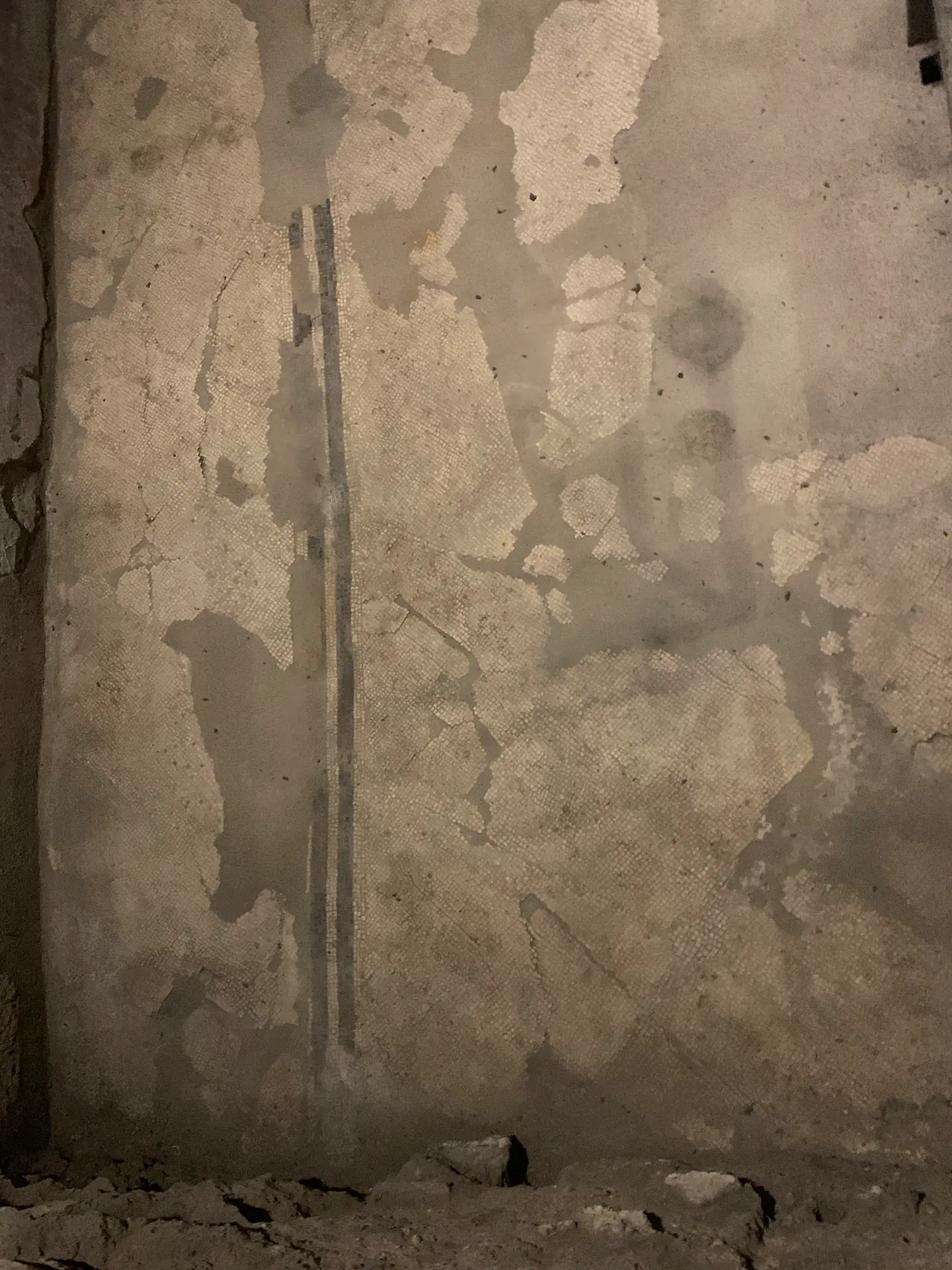 A Roman wall still carrying patches of original plaster below San Lorenzo Maggiore.
