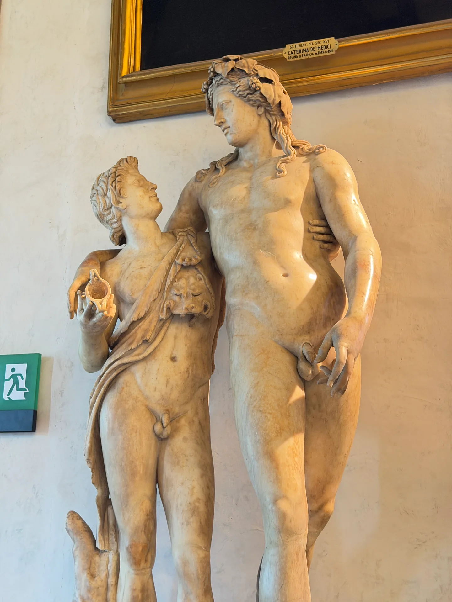 The upper figures of the wreathed marble group, close.