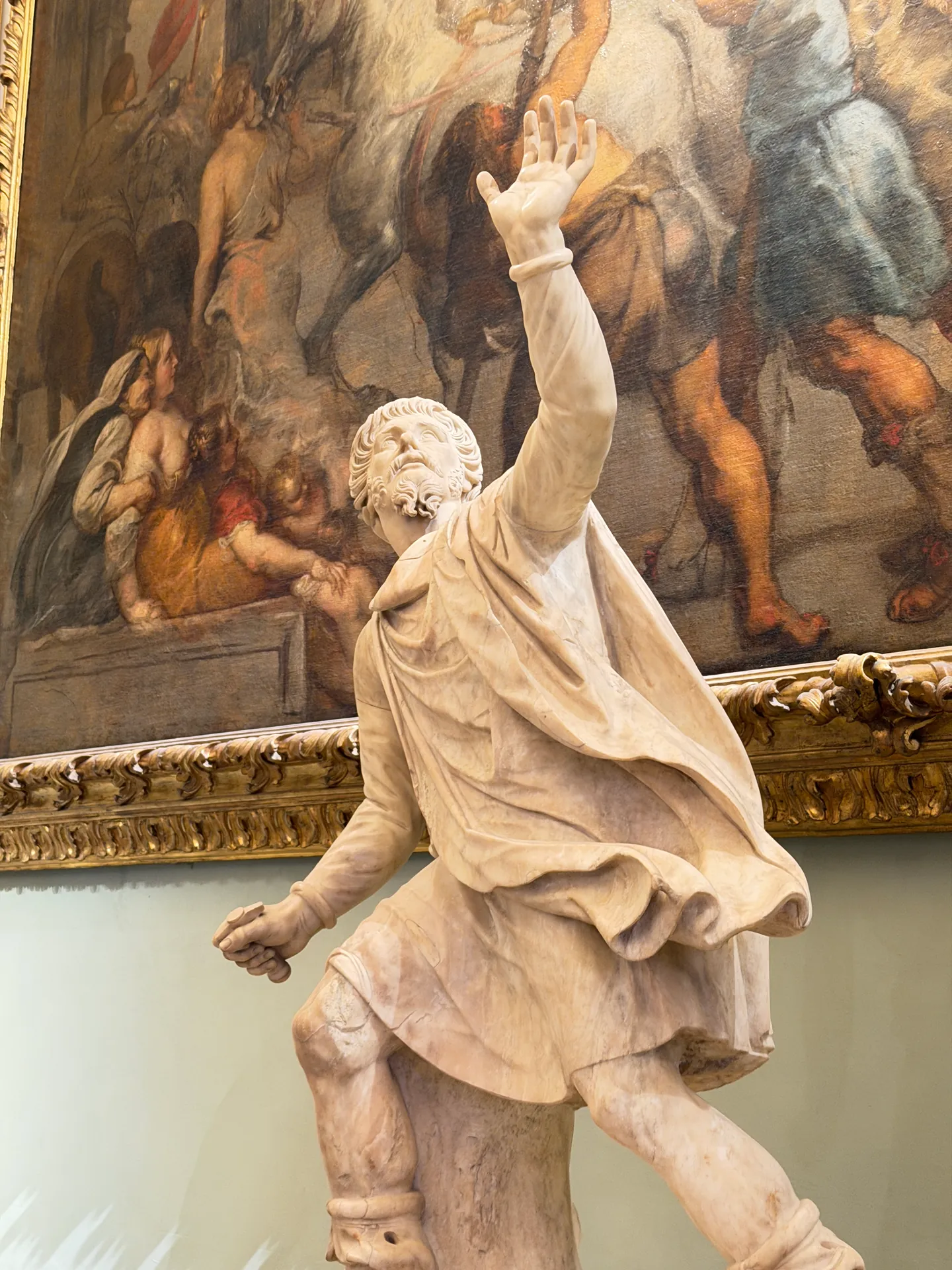 A running Niobid with one arm raised, her drapery swinging out behind her.