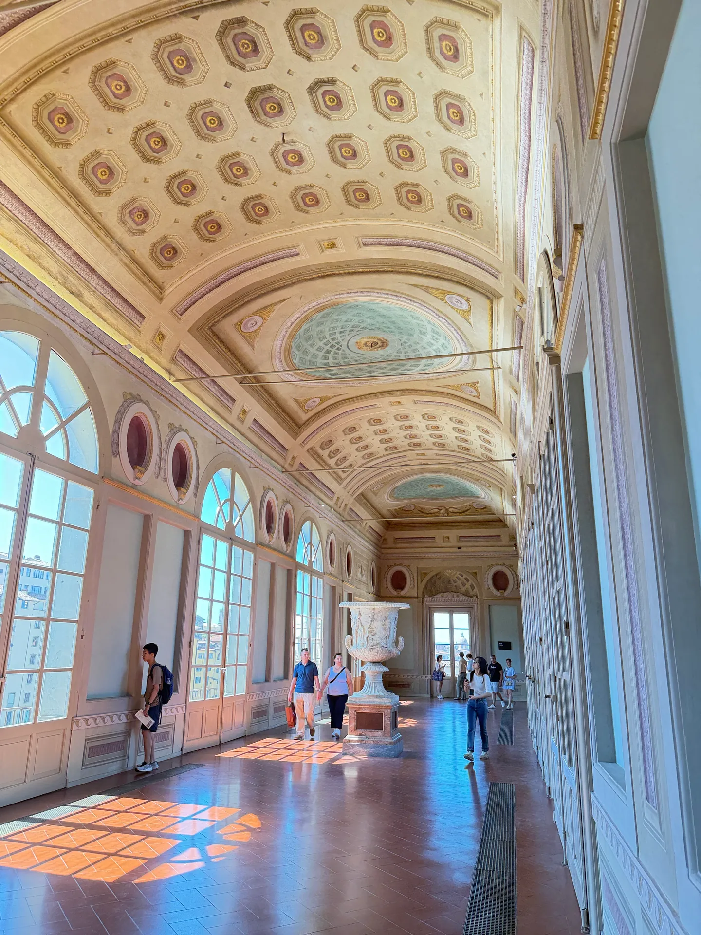 The vaulted gallery across the Arno end of the Uffizi, the short arm joining the two long corridors.