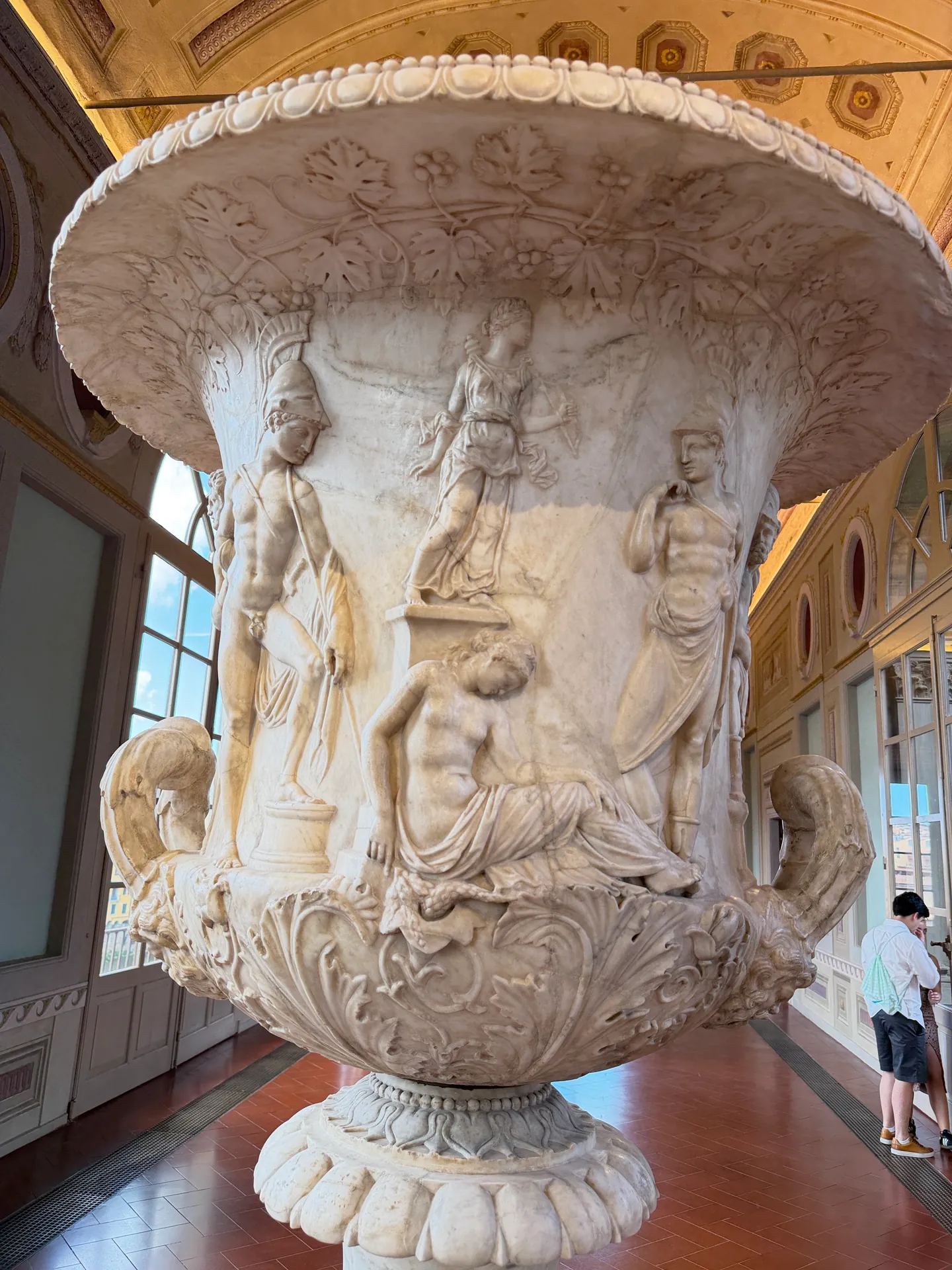 The monumental marble krater known as the Medici Vase, its figured relief frieze running round the body.