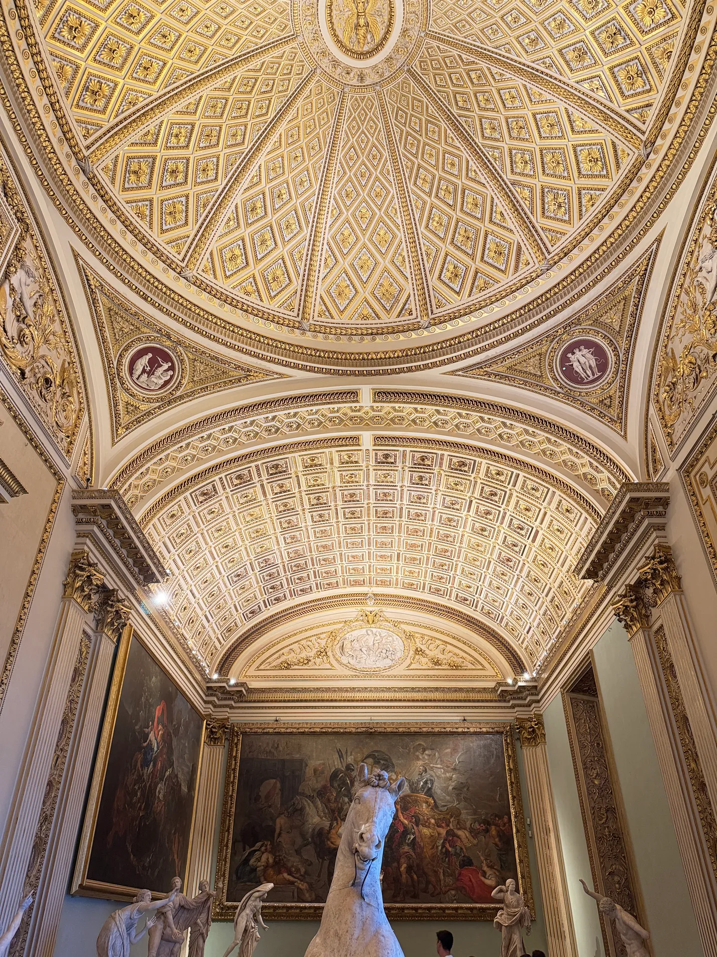 The stuccoed coffered vault of the Sala della Niobe seen straight up.