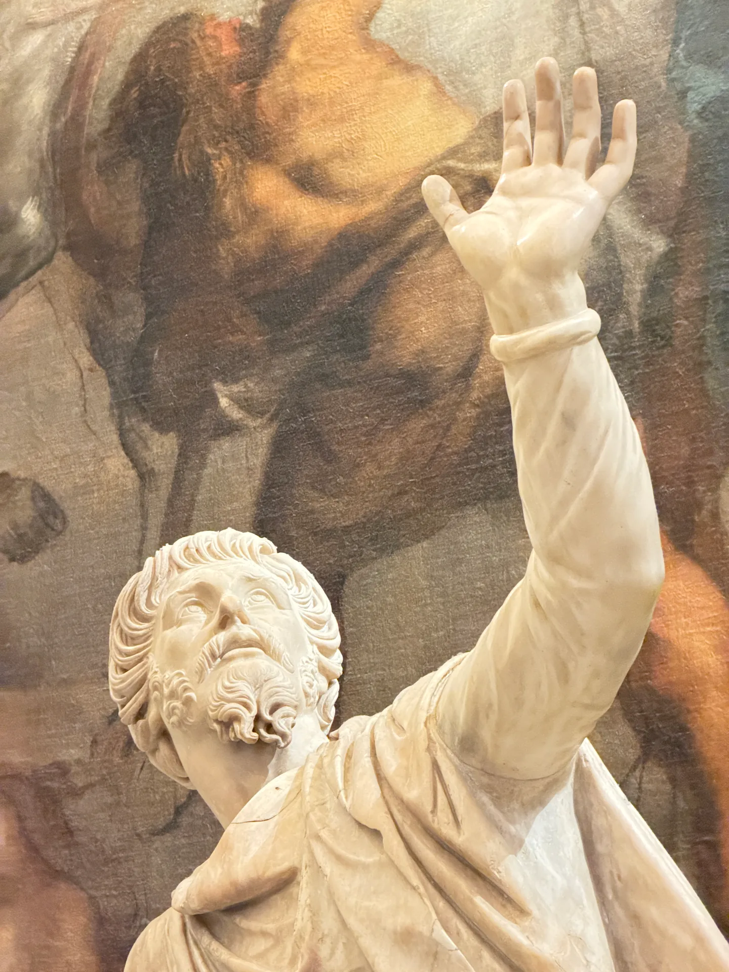 The bearded tutor of the Niobids, head and raised arm, close.