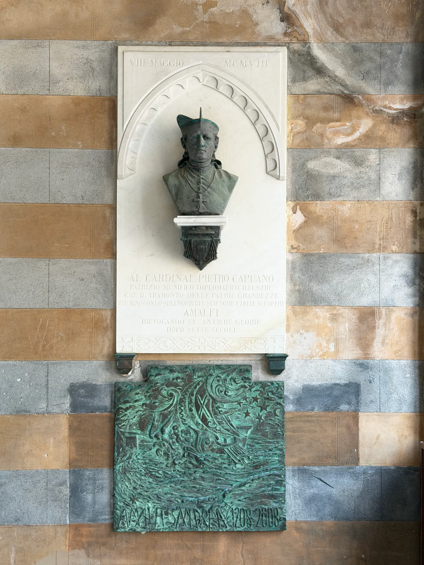 Marble memorial with a bronze bust of Cardinal Pietro Capuano and a bronze relief of a ship, dated 1908