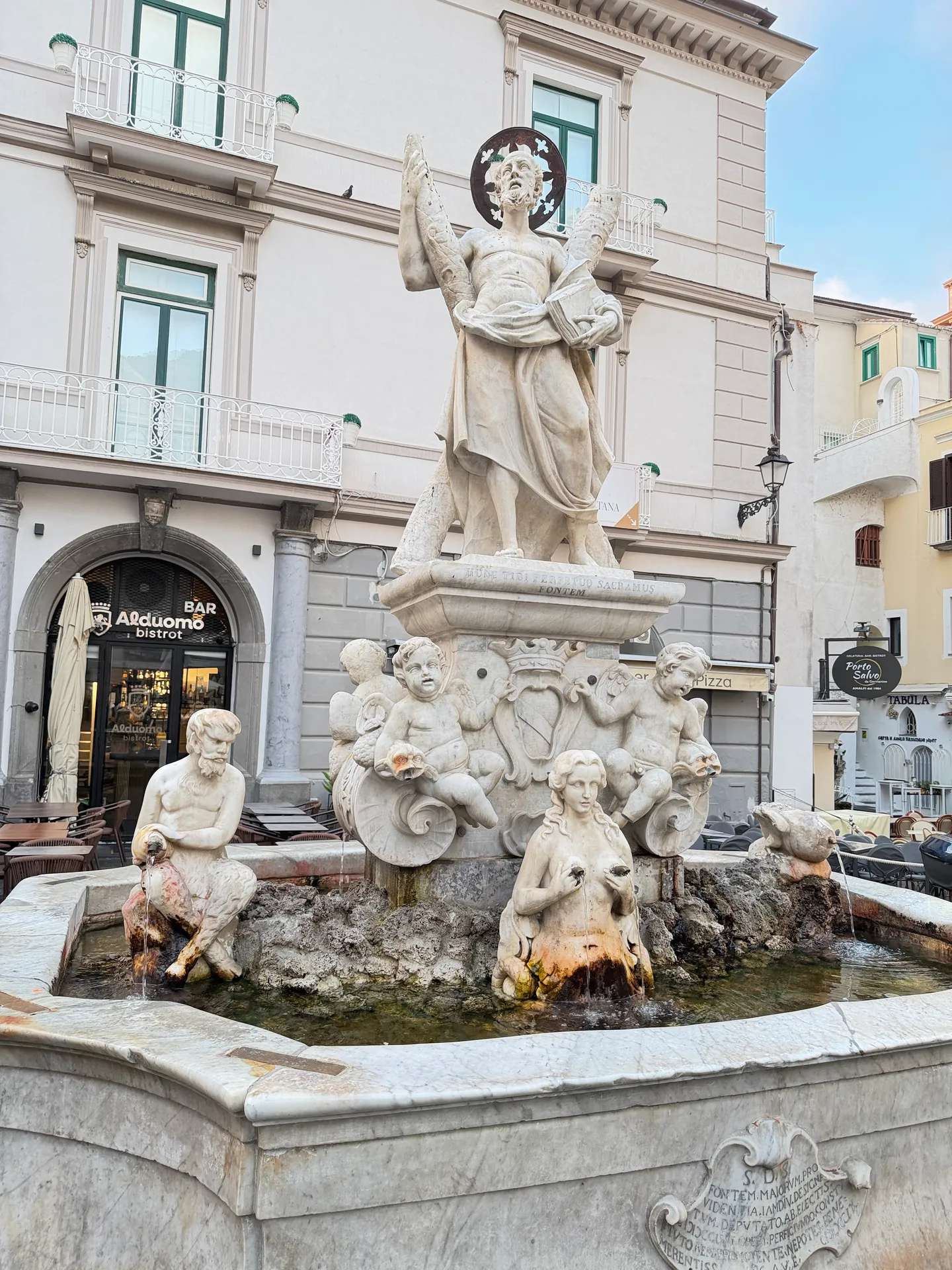 The Fontana di Sant'Andrea in Piazza Duomo, Saint Andrew with his cross above cherubs, a siren spout and a carved cartouche