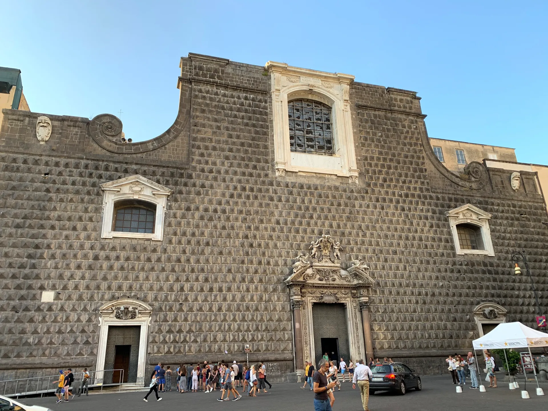 The diamond-point stone facade of the Gesรน Nuovo church in Naples