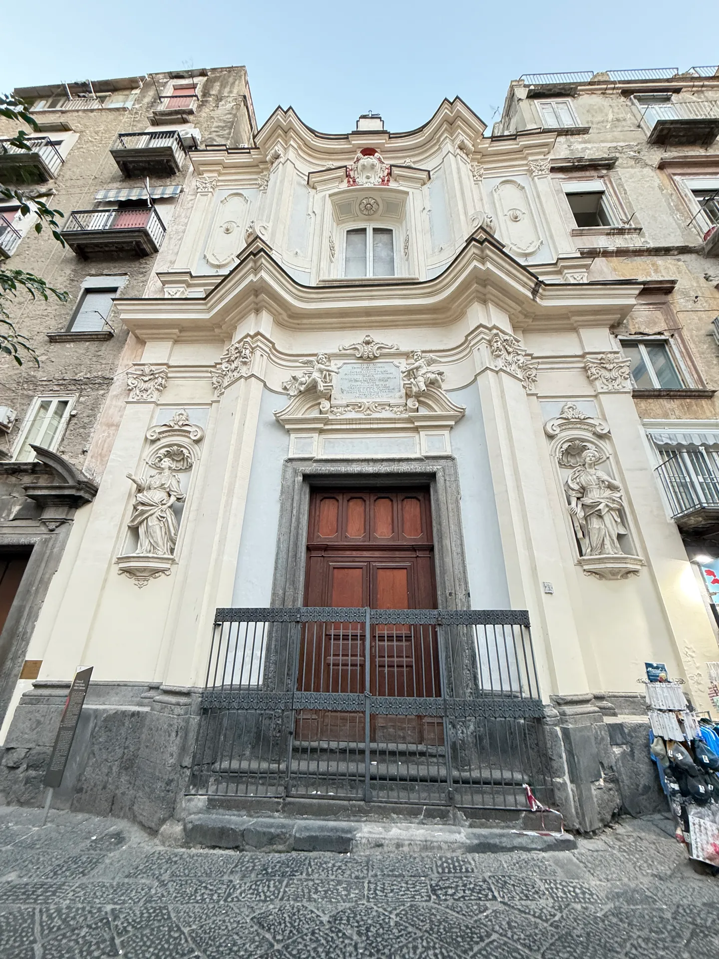 The door of the Chiesa di Santa Maria della Colonna with statues in niches, Naples