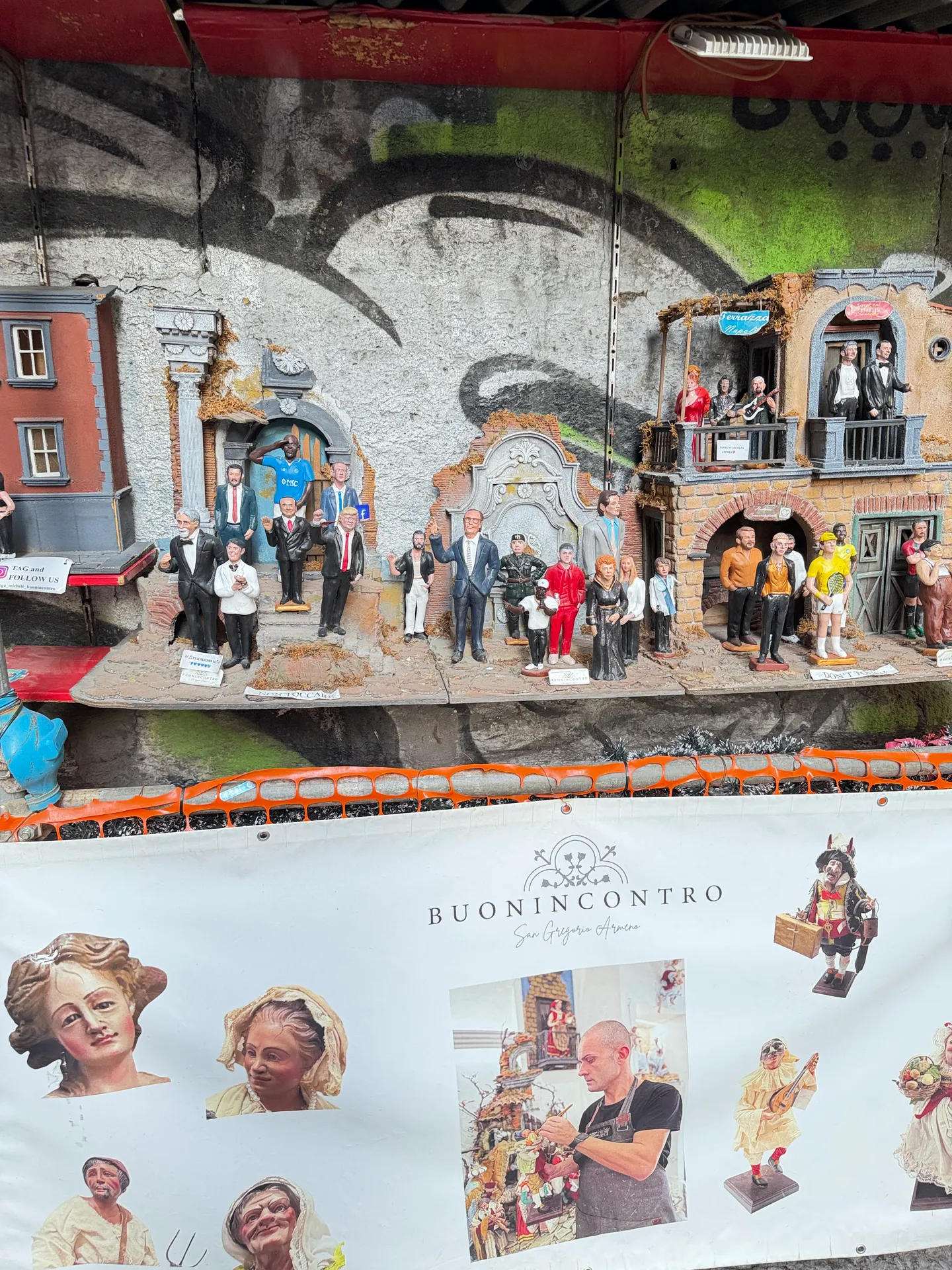 A nativity scene of modern figures above the Buonincontro banner, San Gregorio Armeno