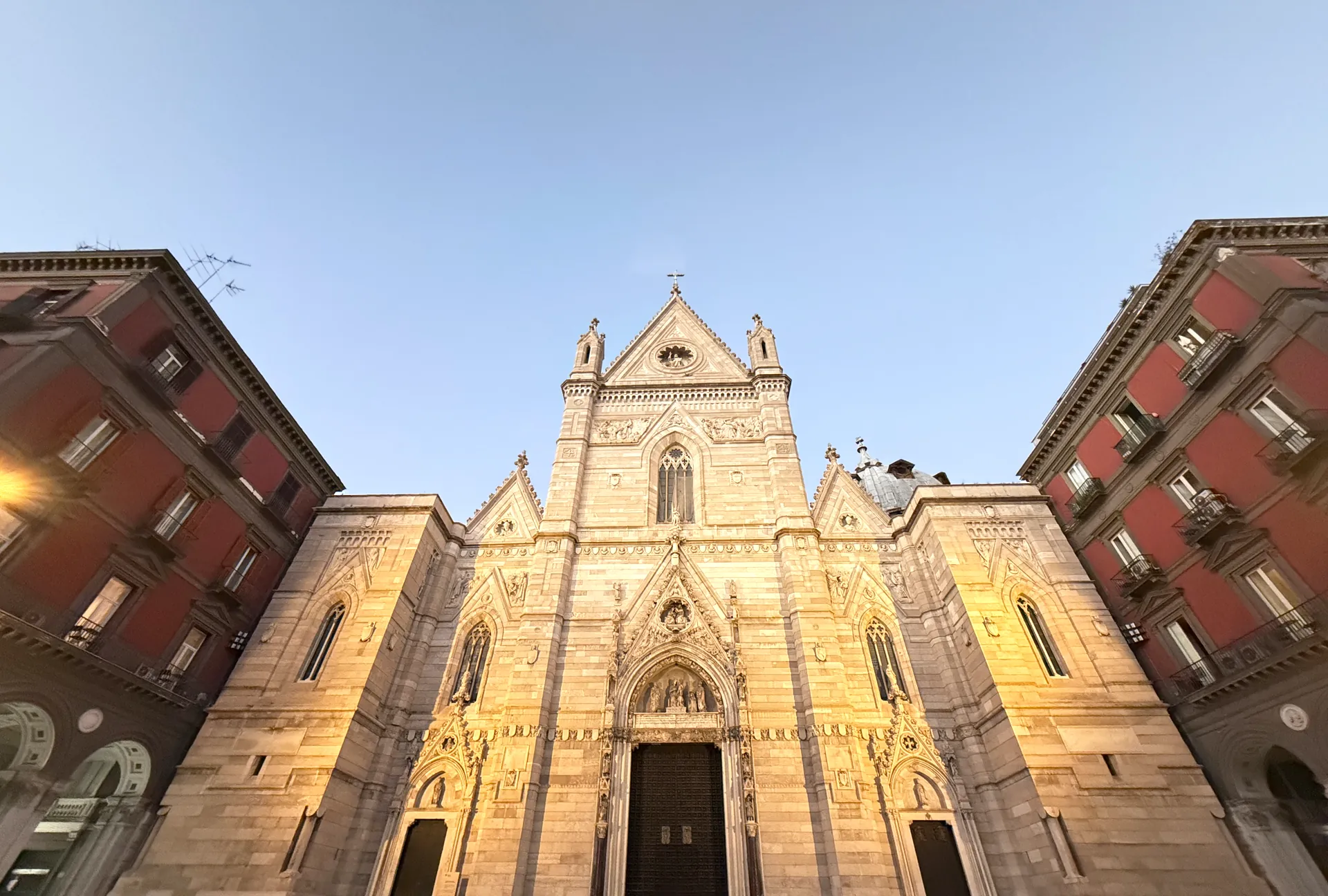 The three carved portals of the Duomo of Naples seen from the street