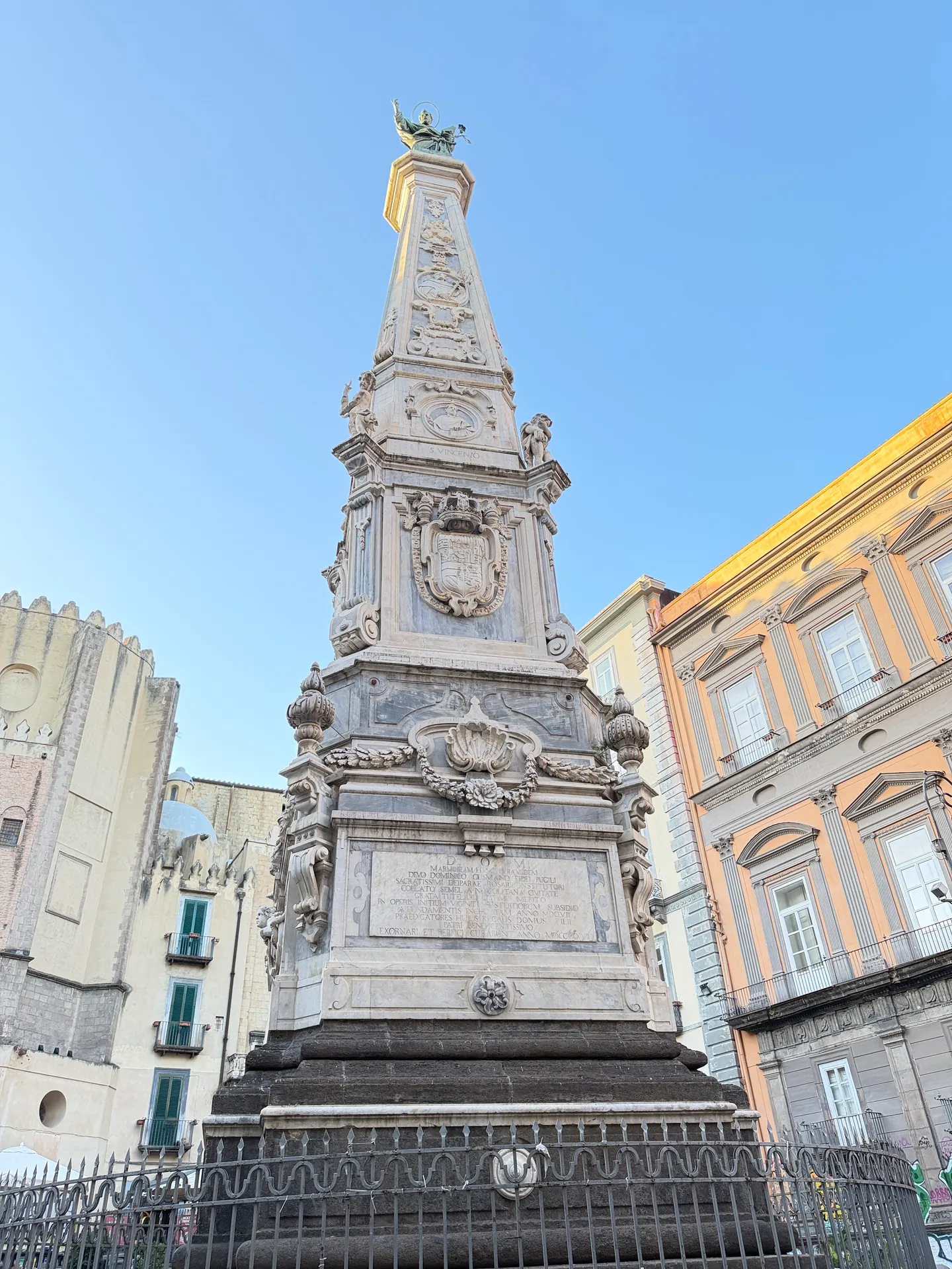 A newspaper kiosk at the foot of the obelisk in Piazza San Domenico Maggiore, Naples