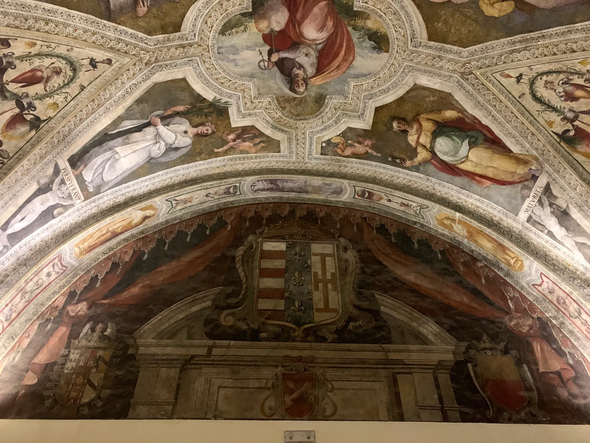 A painted vault with figures in a church in the historic centre of Naples