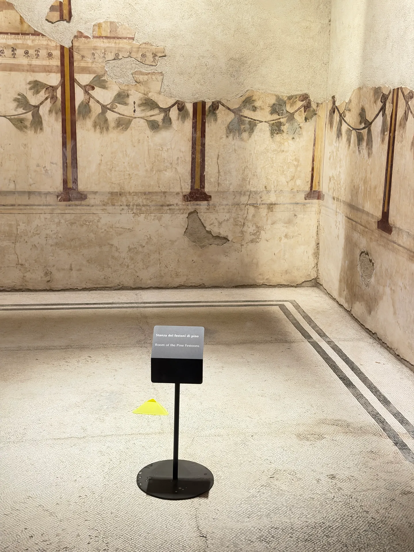 Room of the Pine Festoons in the House of Augustus, painted garlands above a mosaic-bordered floor.