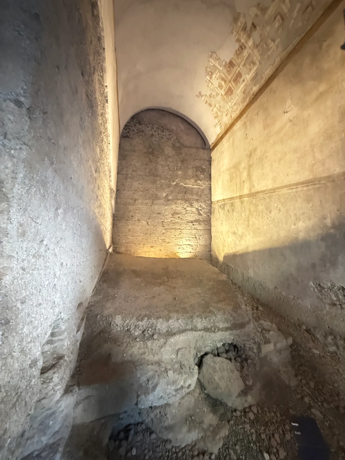 Vaulted passage in the House of Augustus in plain light, painted stucco surviving high on the right wall.