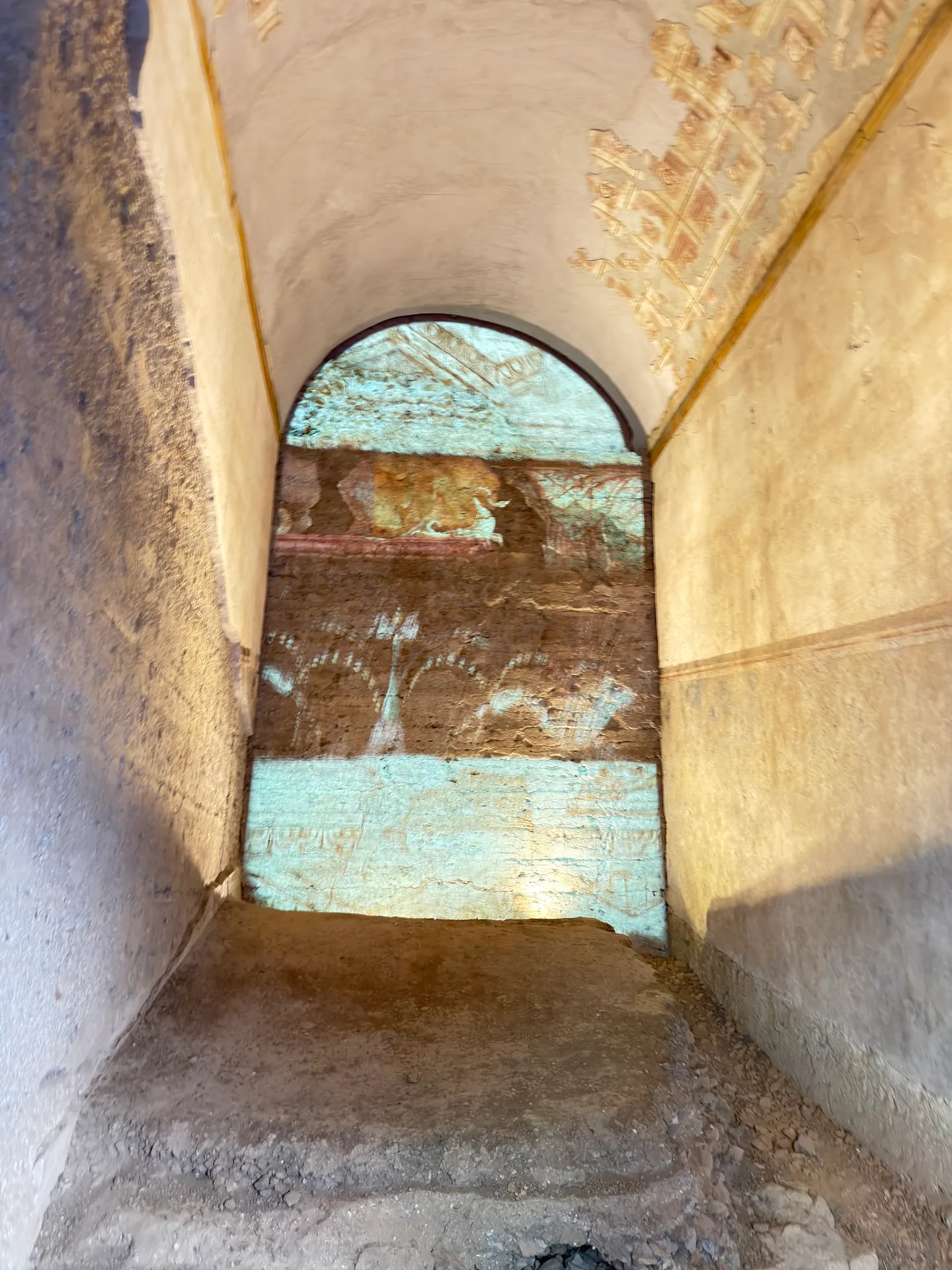 Projected reconstruction of painted decoration filling the arch of a vaulted passage, House of Augustus.